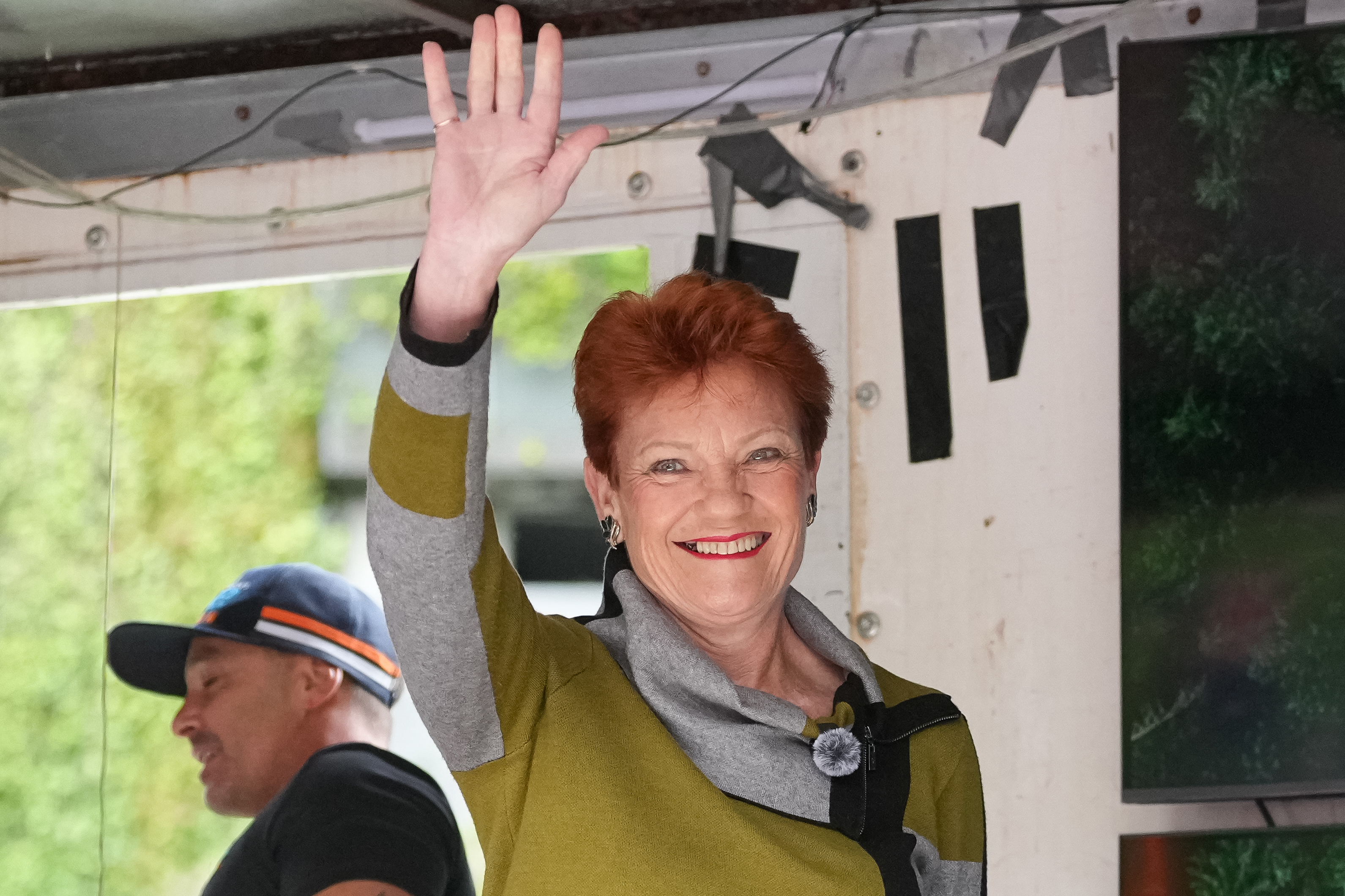 MELBOURNE, AUSTRALIA - NOVEMBER 30: Senator Pauline Hanson waves to the crowd at a Put Australia First Rally on November 30, 2025 in Melbourne, Australia. At least 2,000 people are expected to gather in the Melbourne CBD for the anti-immigration rallies and counter-protests.(Photo by Asanka Ratnayake/Getty Images)