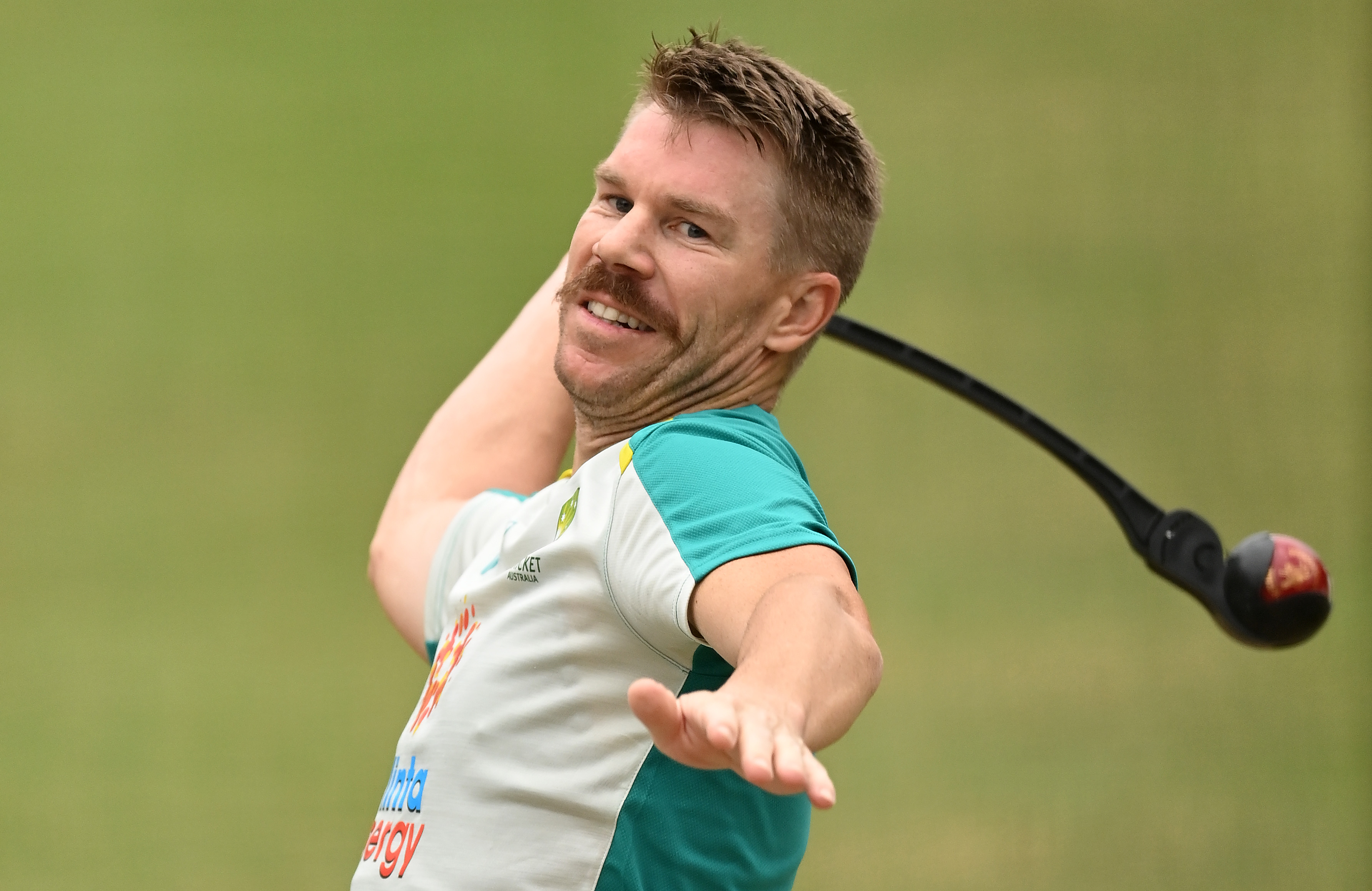 David Warner of Australia warms up in the nets.