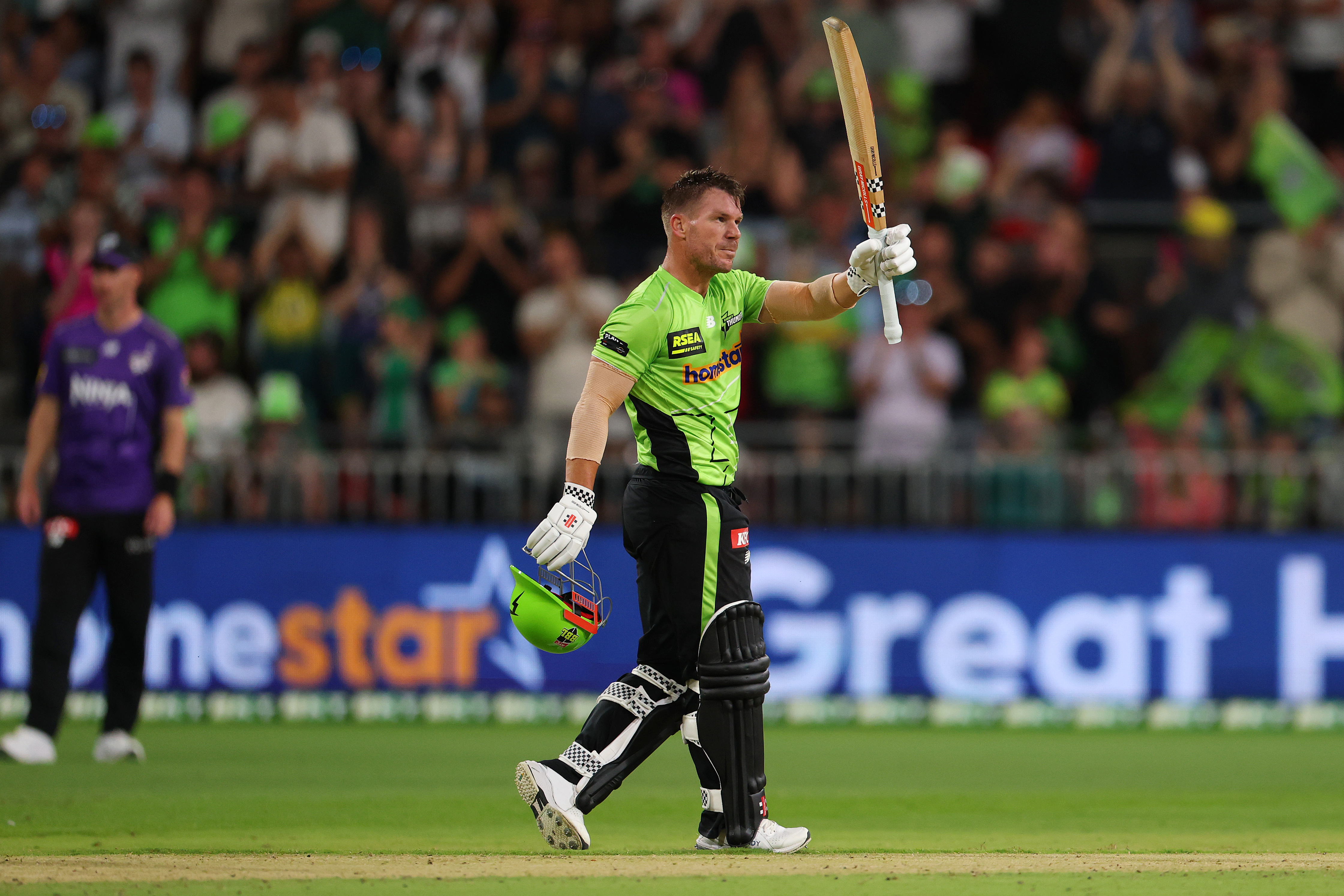 SYDNEY, AUSTRALIA - JANUARY 03: David Warner of the Thunder celebrates scoring a century during the BBL match between Sydney Thunder and Hobart Hurricanes at ENGIE Stadium, on January 03, 2026, in Sydney, Australia (Photo by Morgan Hancock/Getty Images)