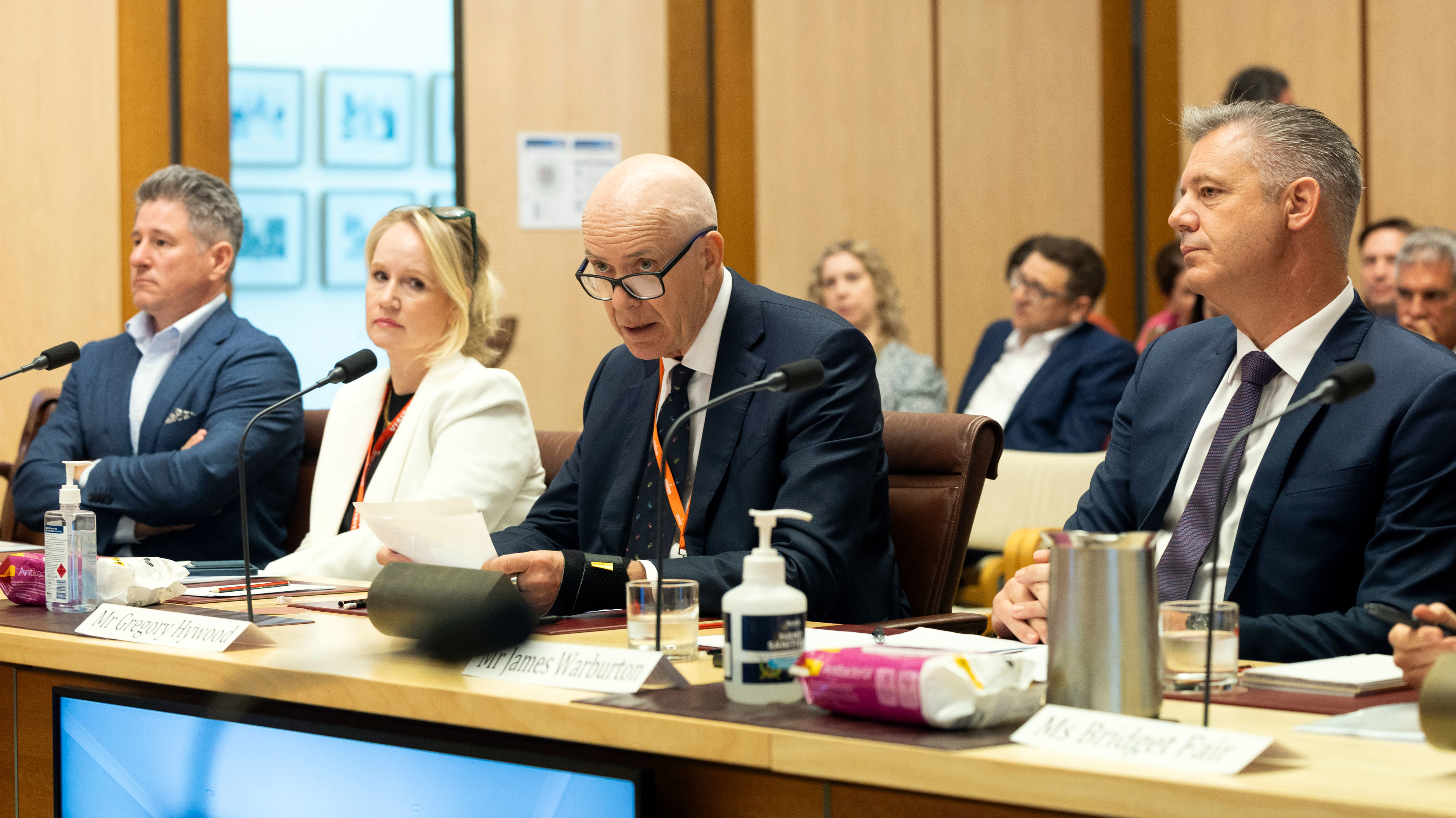 Mike Sneesby, Nine CEO, Beverley McGarvey, Paramount Executive Vice President, Greg Hywood, Free TV Australia chair, and James Warburton, Seven West Media CEO, during a hearing with the Environment and Communications Legislation Committee, at Parliament House in Canberra on Friday 23 February 2024. 