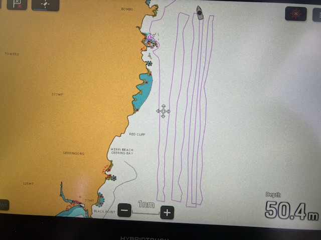 Rescue teams search the NSW South Coast for a missing fisherman who was swept off the rocks at Kiama.