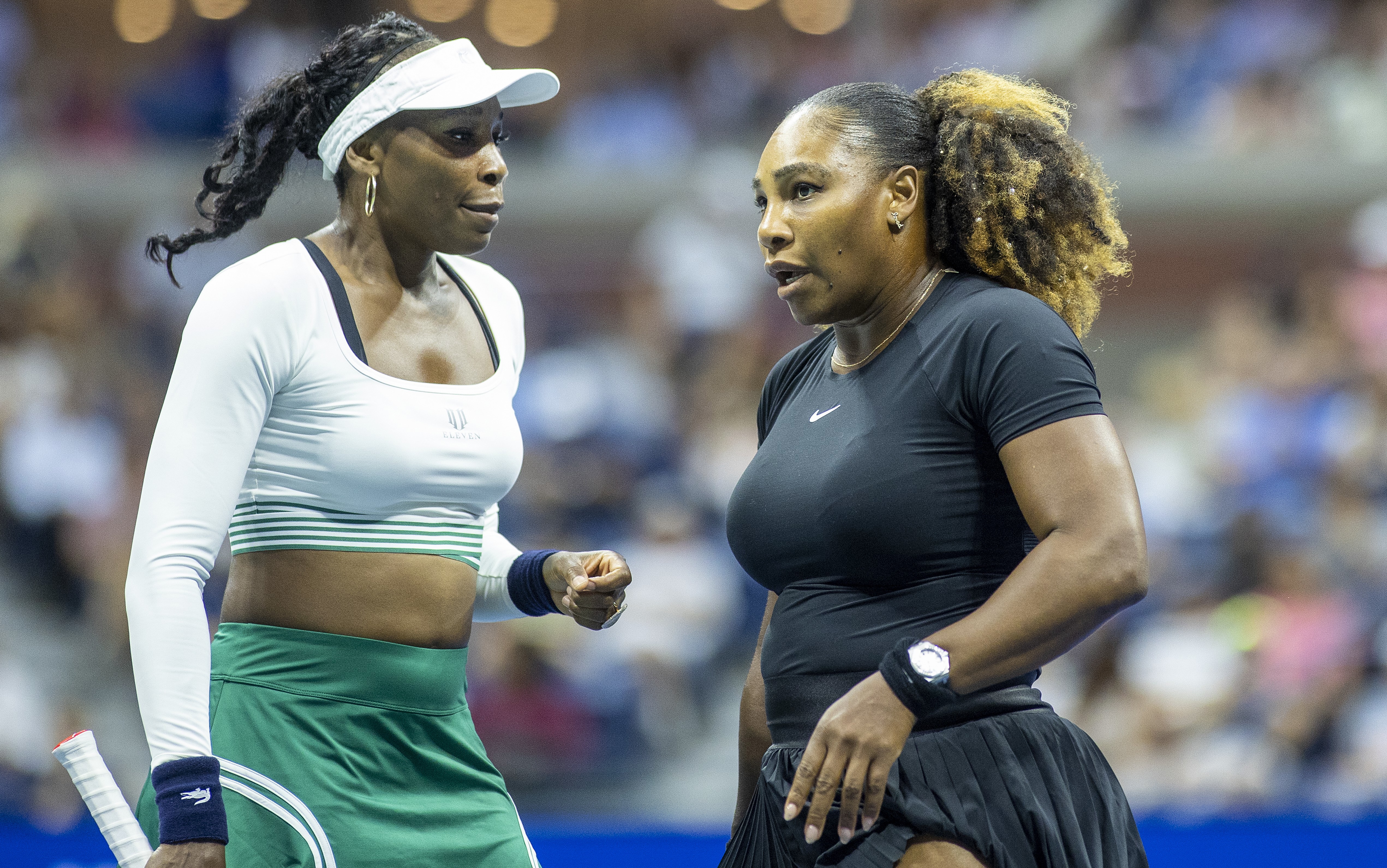 Venus Williams (left) and her sister Serena playing as a doubles pair at the 2022 US Open.