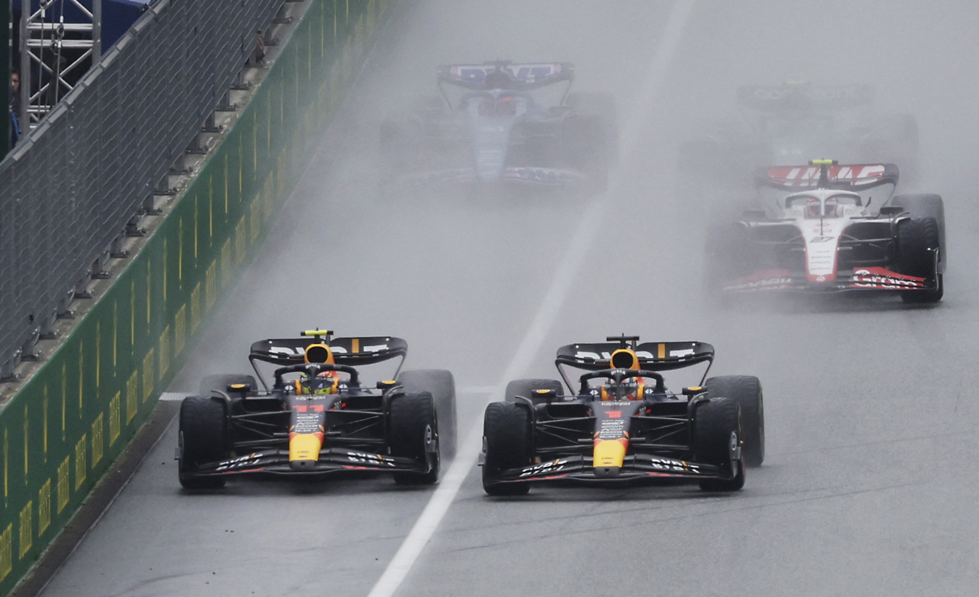 Max Verstappen (right) pushed Sergio Perez across towards the pit wall at the start of the sprint at the Austrian Grand Prix.