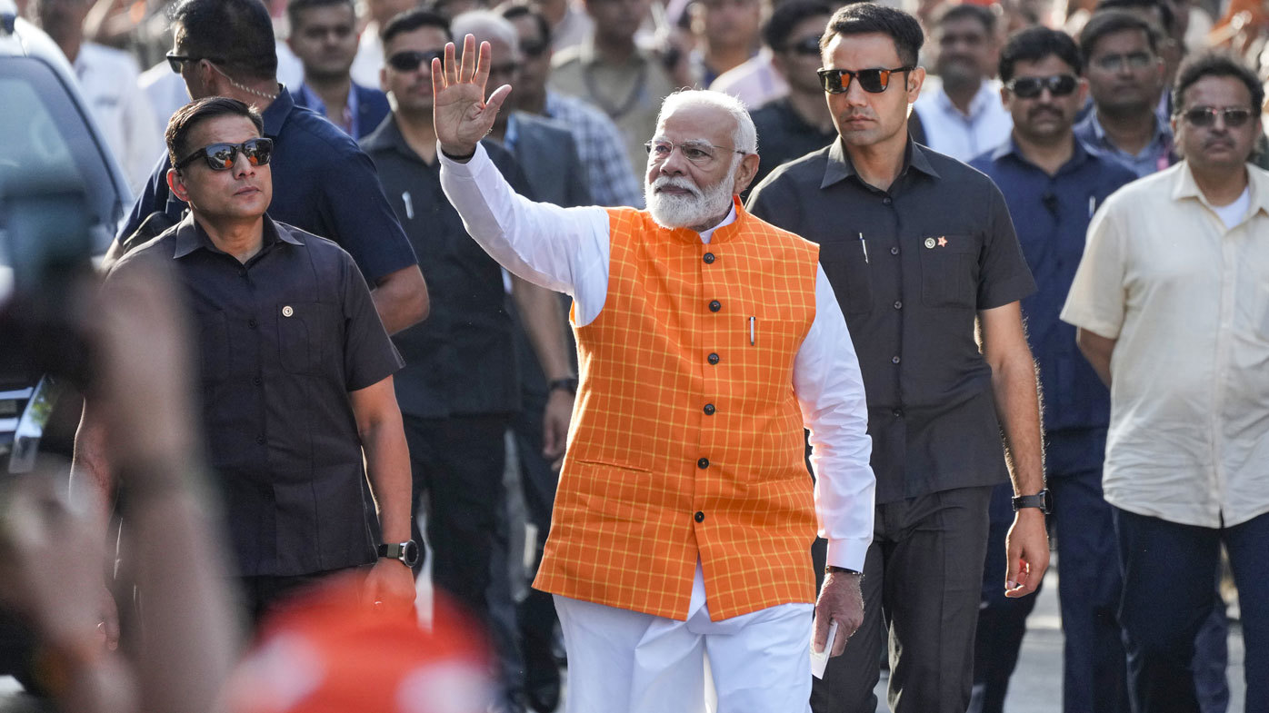 India election 2024 - Indian Prime Minister Narendra Modi waves to people as he arrives to cast his vote during the third phase of India's national election, in Ahmedabad, India, May 7