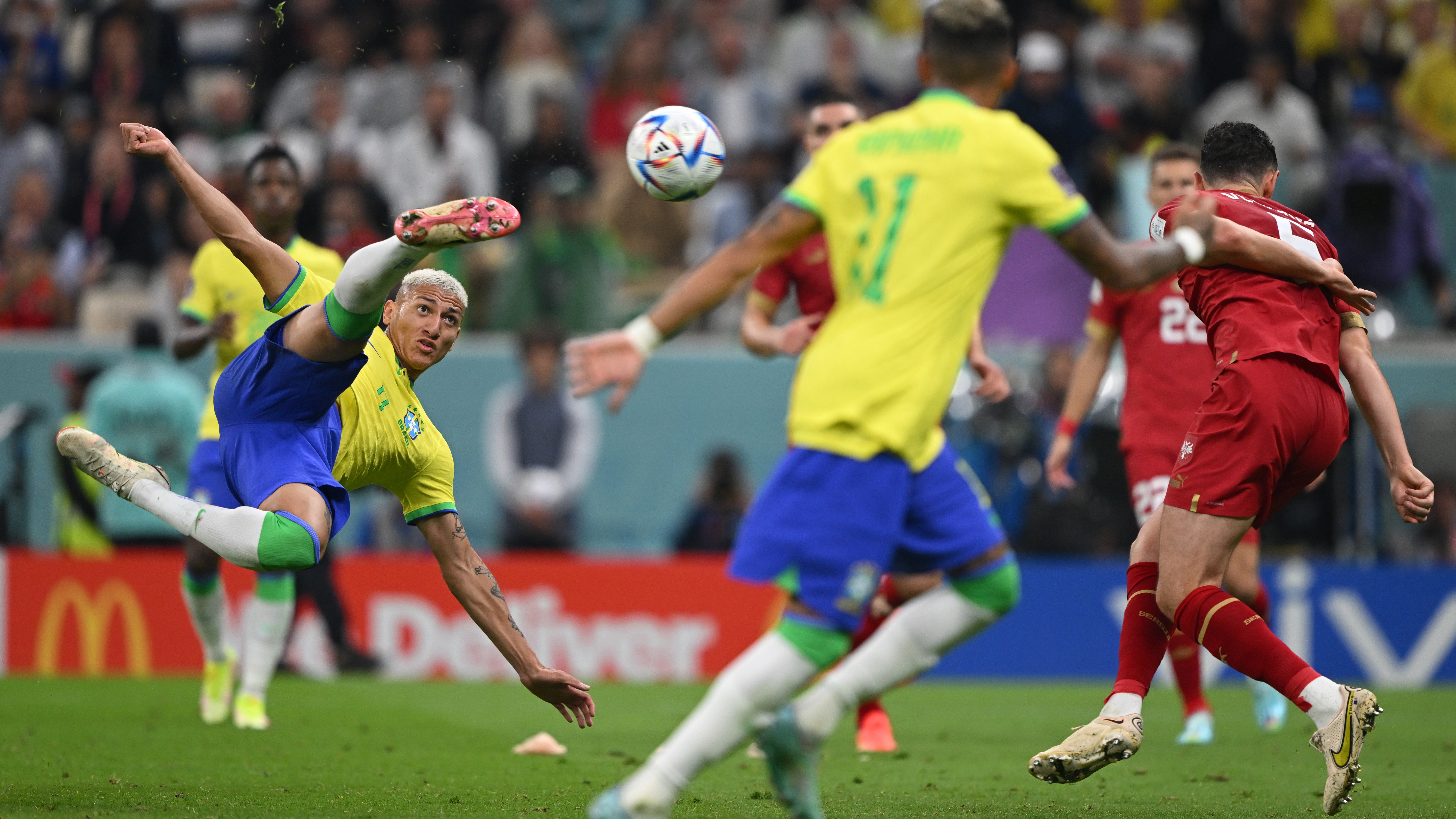 Richarlison of Brazil scores their second goal against Serbia at the World Cup.