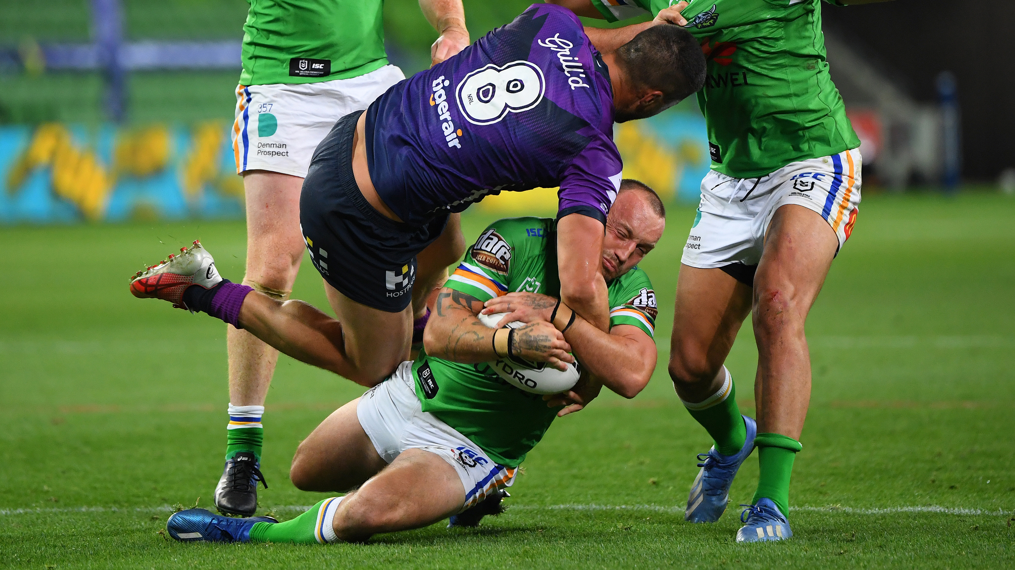 Josh Hodgson strips the ball out of the arms of Jesse Bromwich.