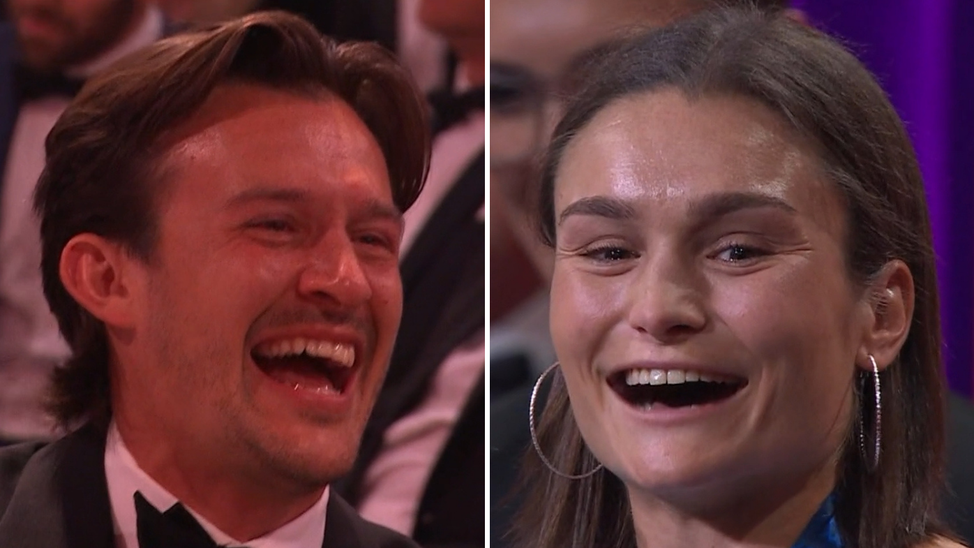 Ash Riddell celebrates her AFLW best and fairest win alongside her husband, Vinnie Atkinson.
