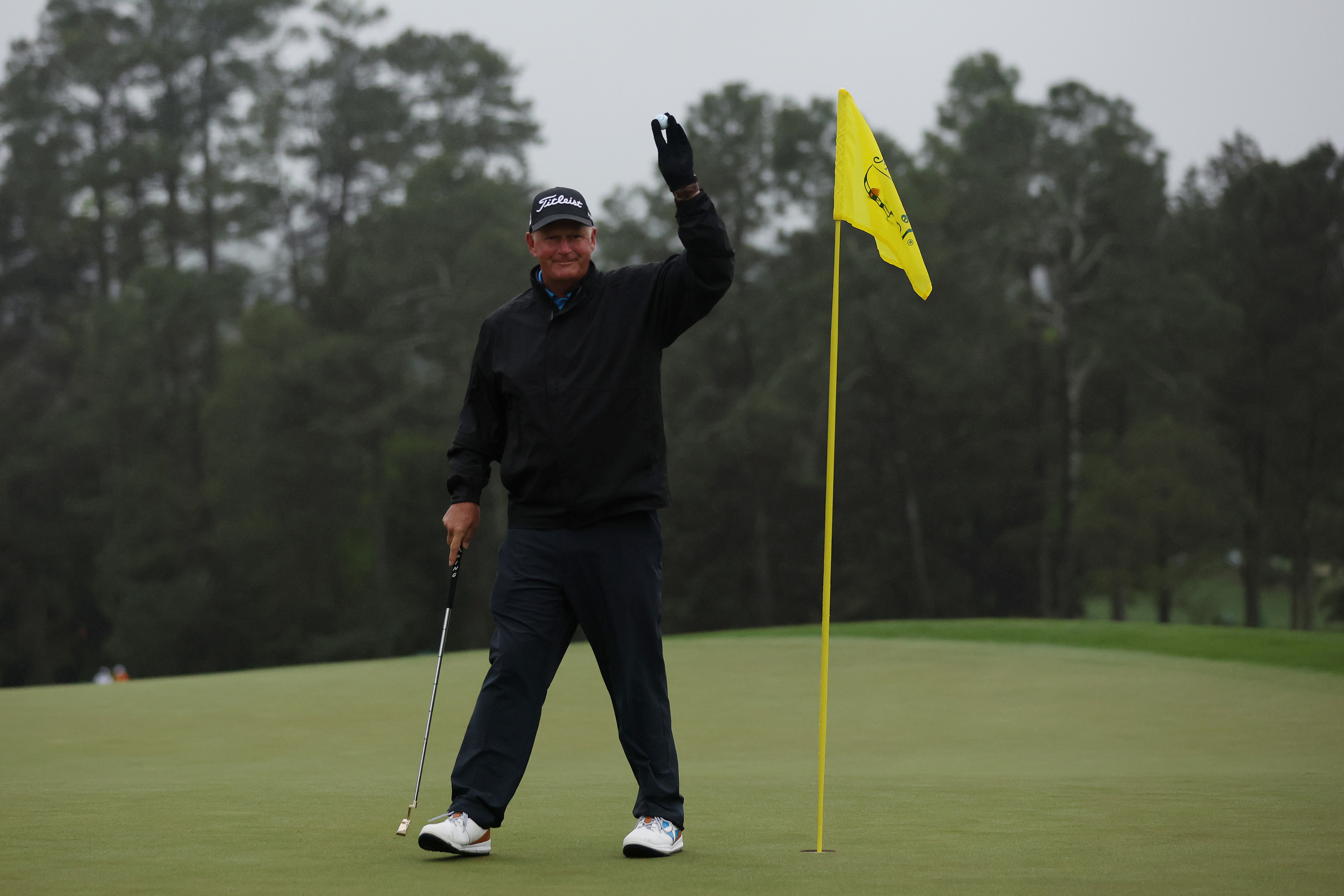 AUGUSTA, GEORGIA - APRIL 08: Sandy Lyle of Scotland acknowledges patrons on the 18th green during the continuation of the weather delayed second round of the 2023 Masters Tournament at Augusta National Golf Club on April 08, 2023 in Augusta, Georgia. (Photo by Christian Petersen/Getty Images)