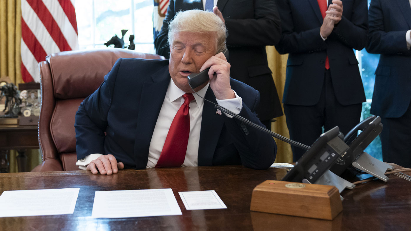 The button on a wooden box was one of the few things consistently on Donald Trump's desk.