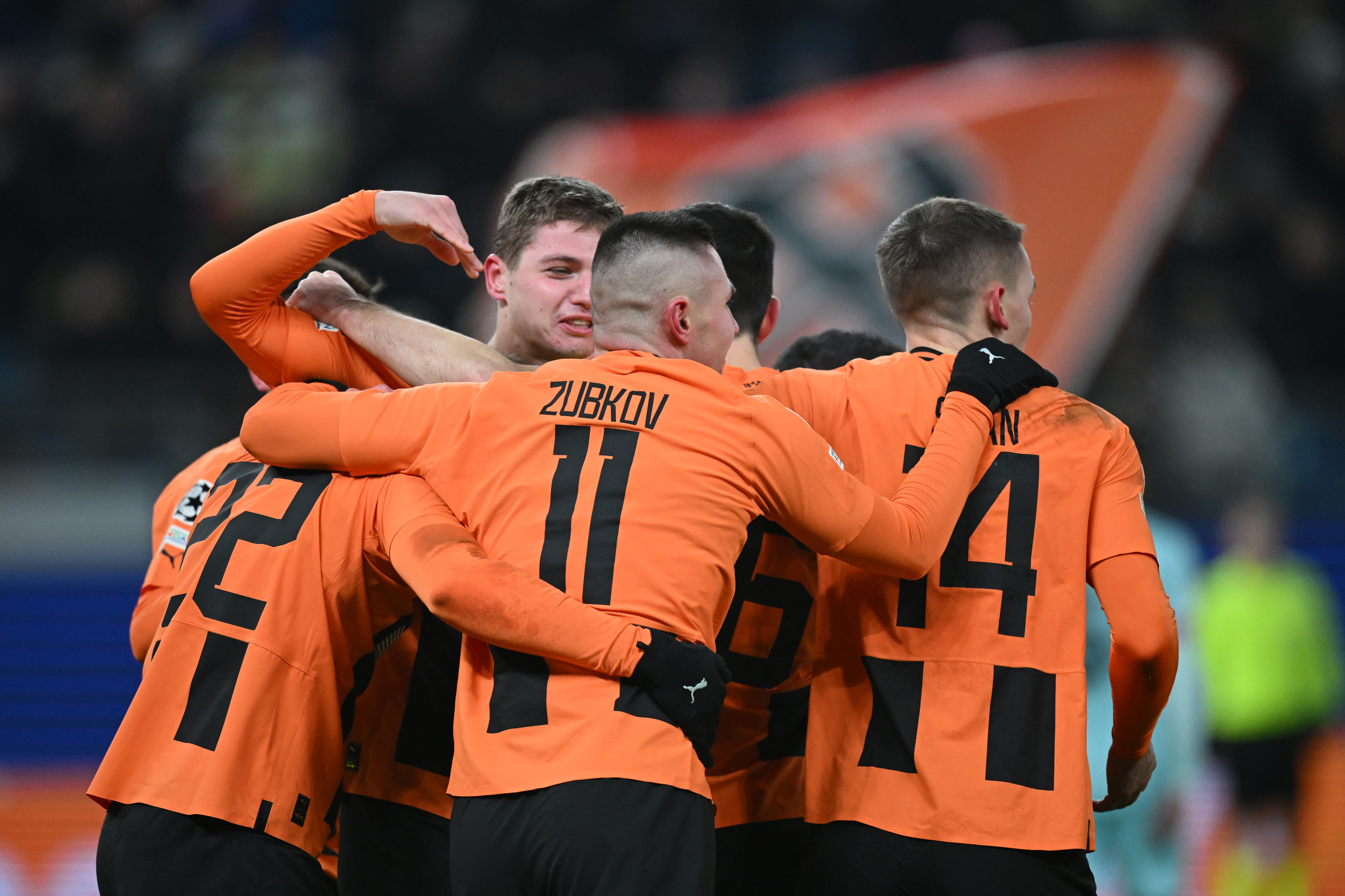 Mykola Matviyenko of Shakhtar Donetsk celebrates with teammates after scoring.
