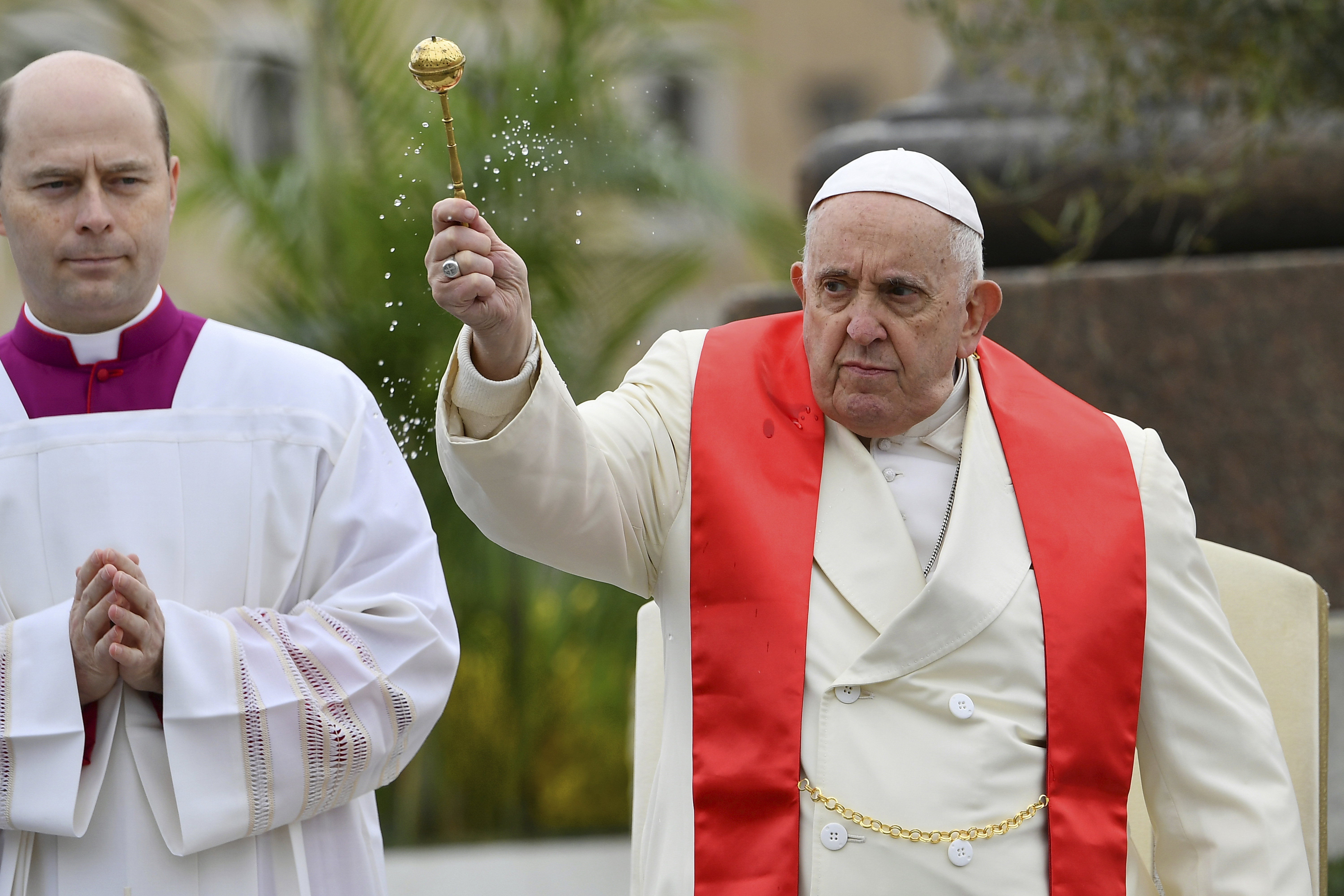 Pope Francis blesses faithful with olive and palm branches before celebrating the Palm Sunday's mass in St. Peter's Square at The Vatican Sunday, April 2, 2023 