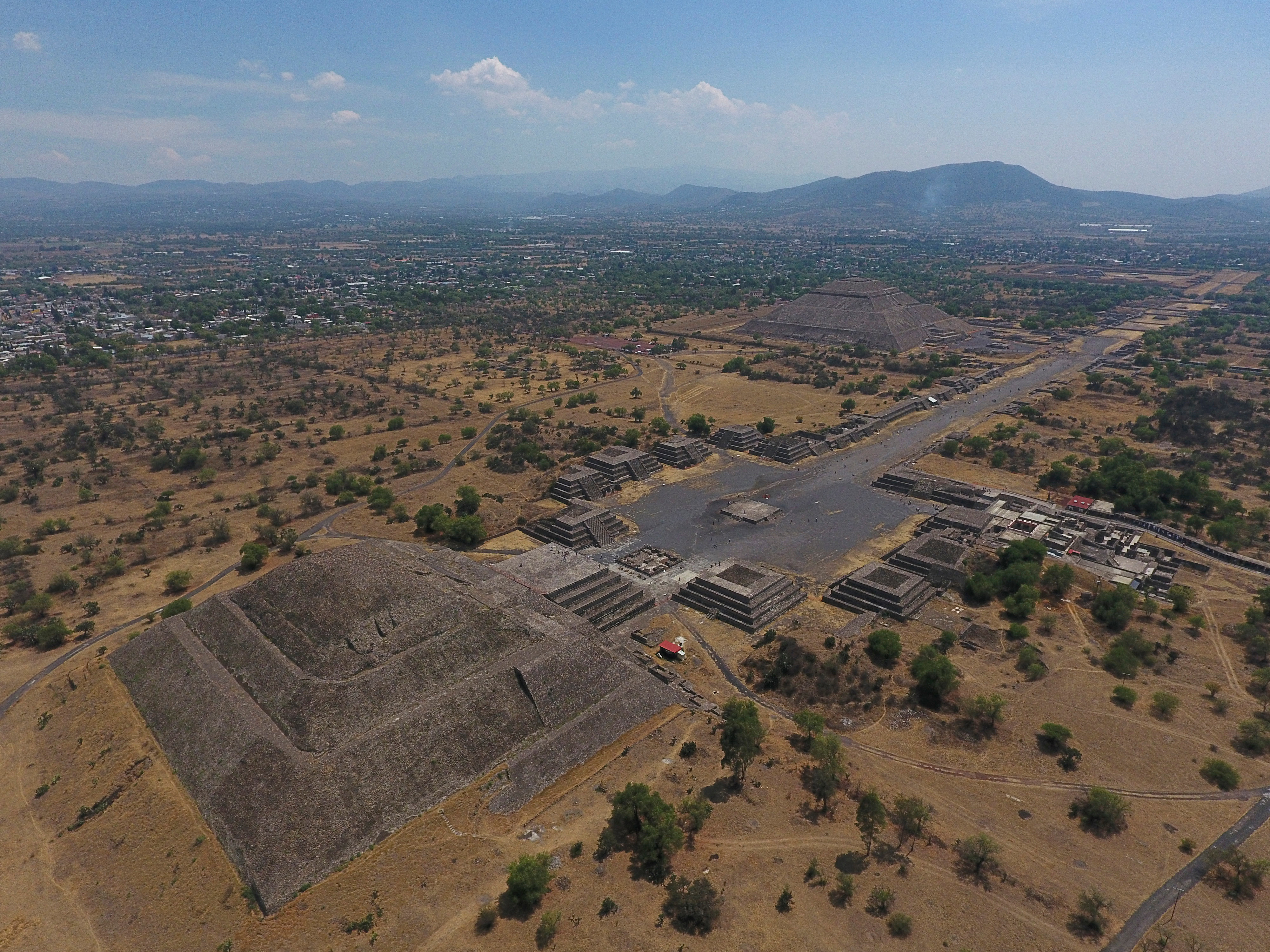 The Pyramid of the Moon, left, and the Pyramid of the Sun, back right, are seen along with smaller structures lining the Avenue of the Dead, in Teotihuacan, Mexico.