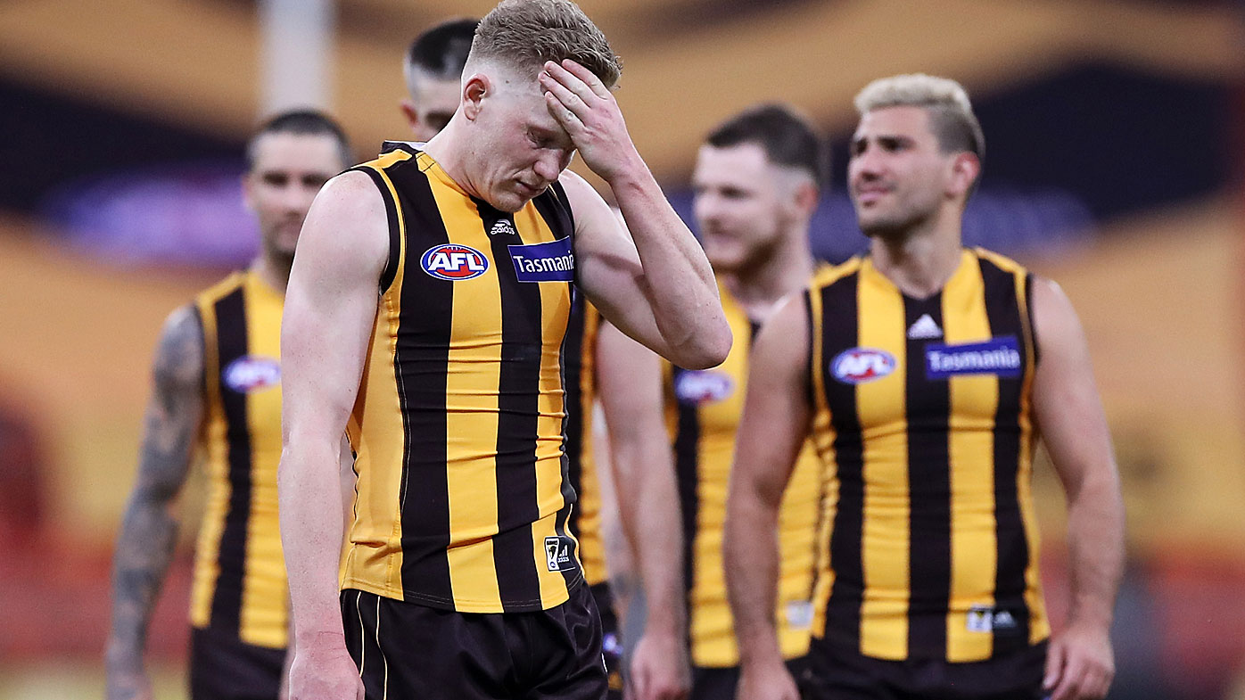 James Sicily of the Hawks and his team mates look dejected 