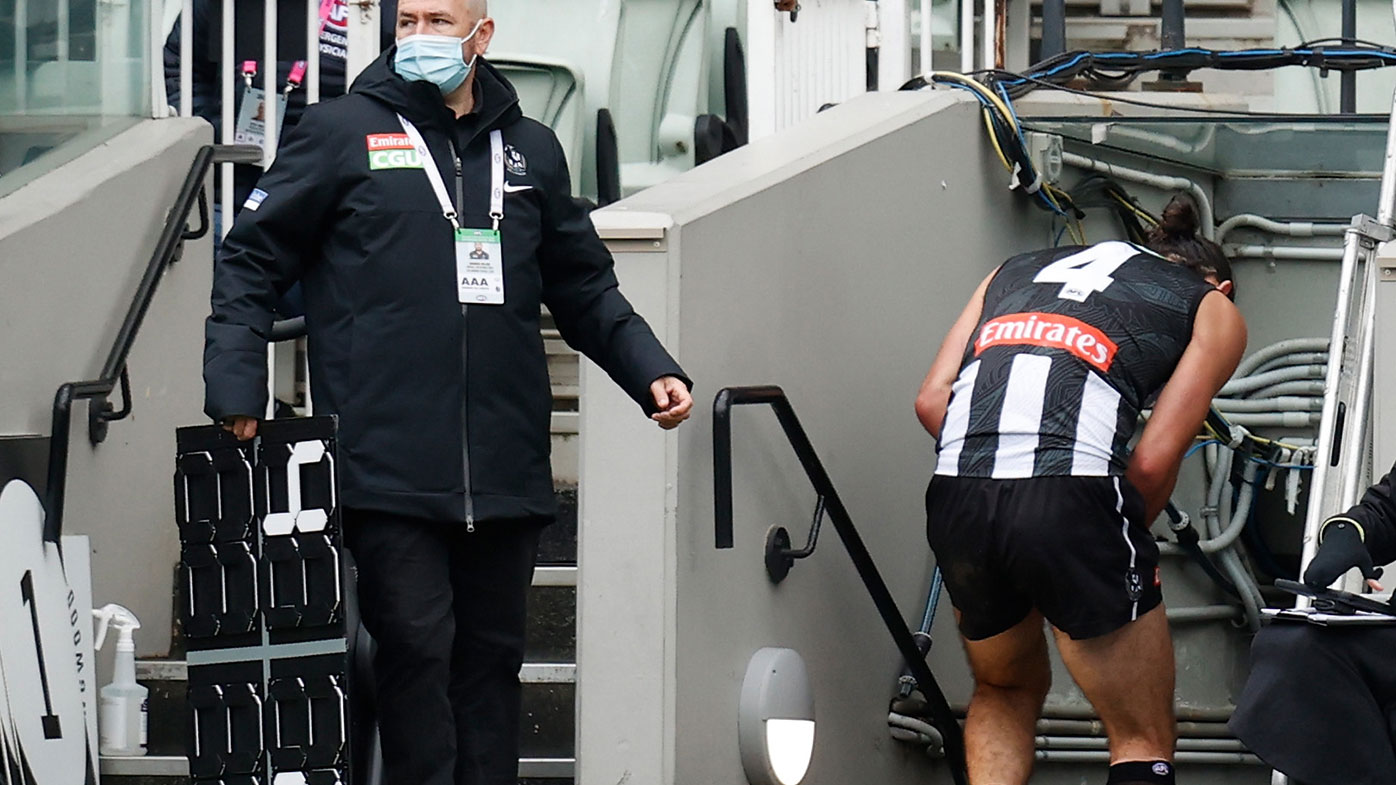 Brodie Grundy heads for the rooms after being subbed out of Collingwood's match against Geelong.