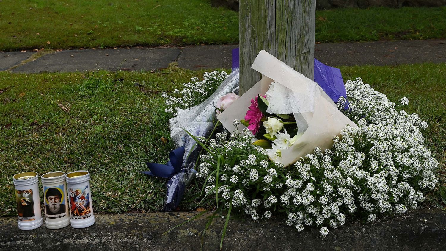 Flowers and candles left outside of the Lalor Park home in Sydney's west in July.