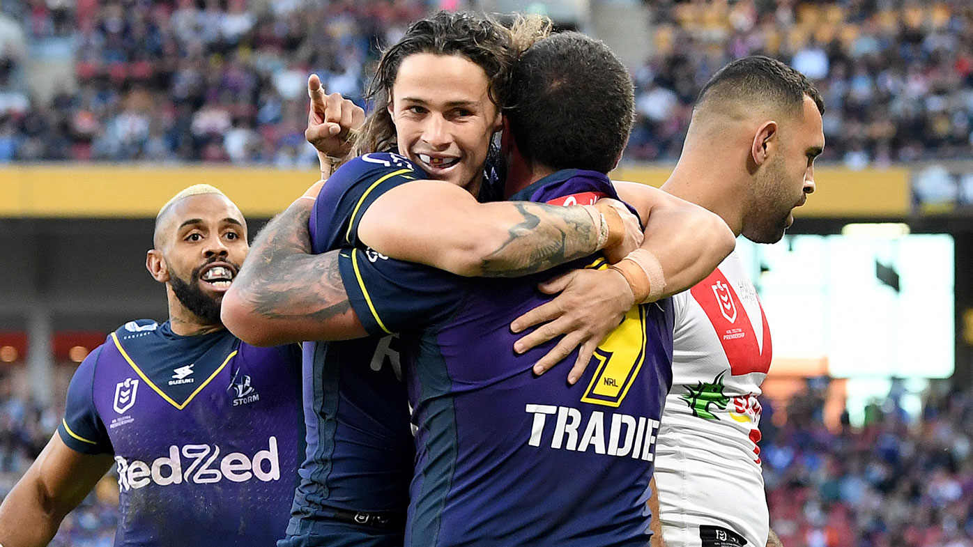 Kenneath Bromwich of the Storm is congratulated by team mate Nicho Hynes after scoring a try during the round 10 NRL match between the Melbourne Storm and the St George Illawarra Dragons at Suncorp Stadium, on May 16, 2021, in Brisbane, Australia. (Photo by Bradley Kanaris/Getty Images)