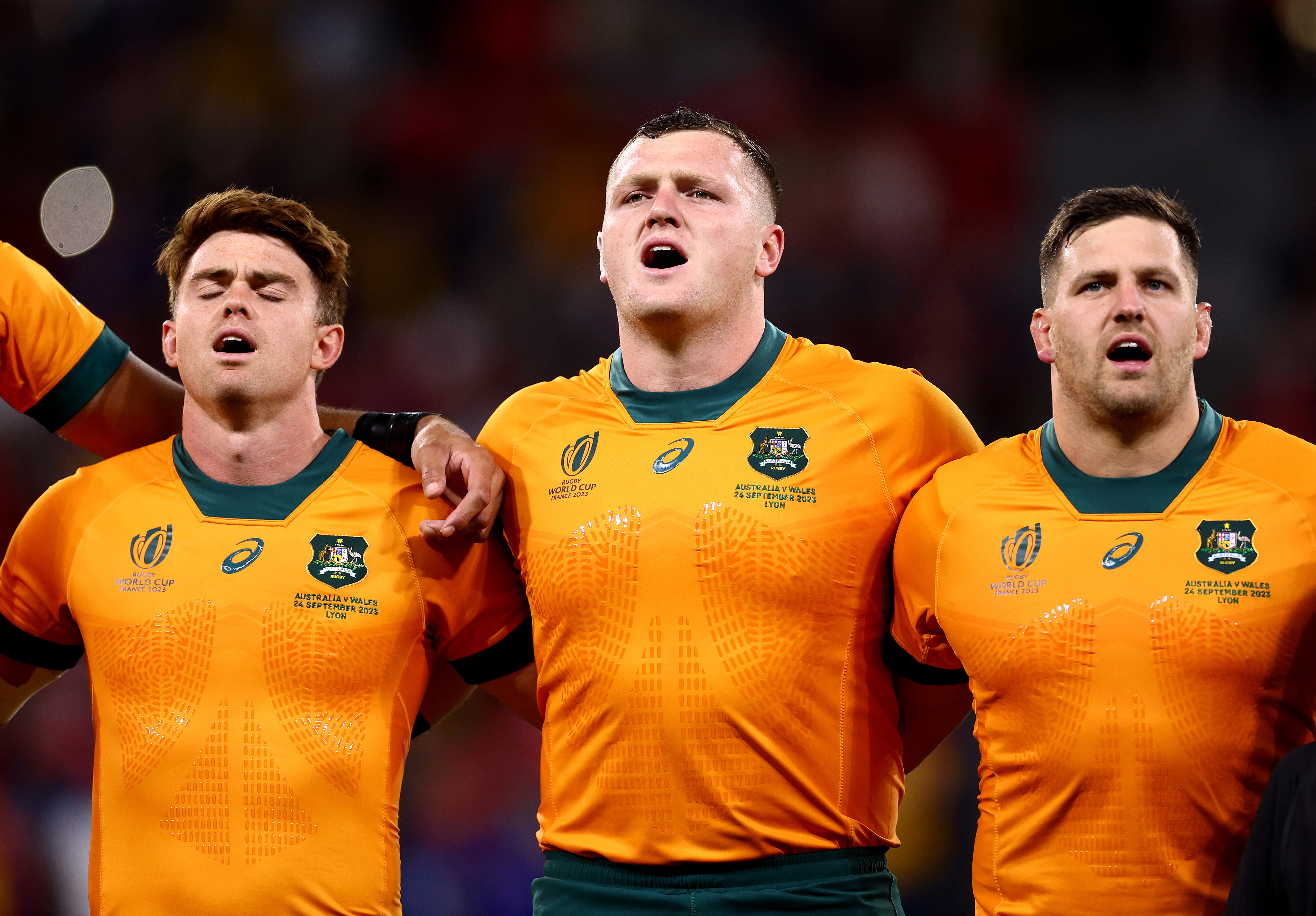 (From left) Andrew Kellaway, Angus Bell and Dave Porecki of Australia sing their national anthem prior.