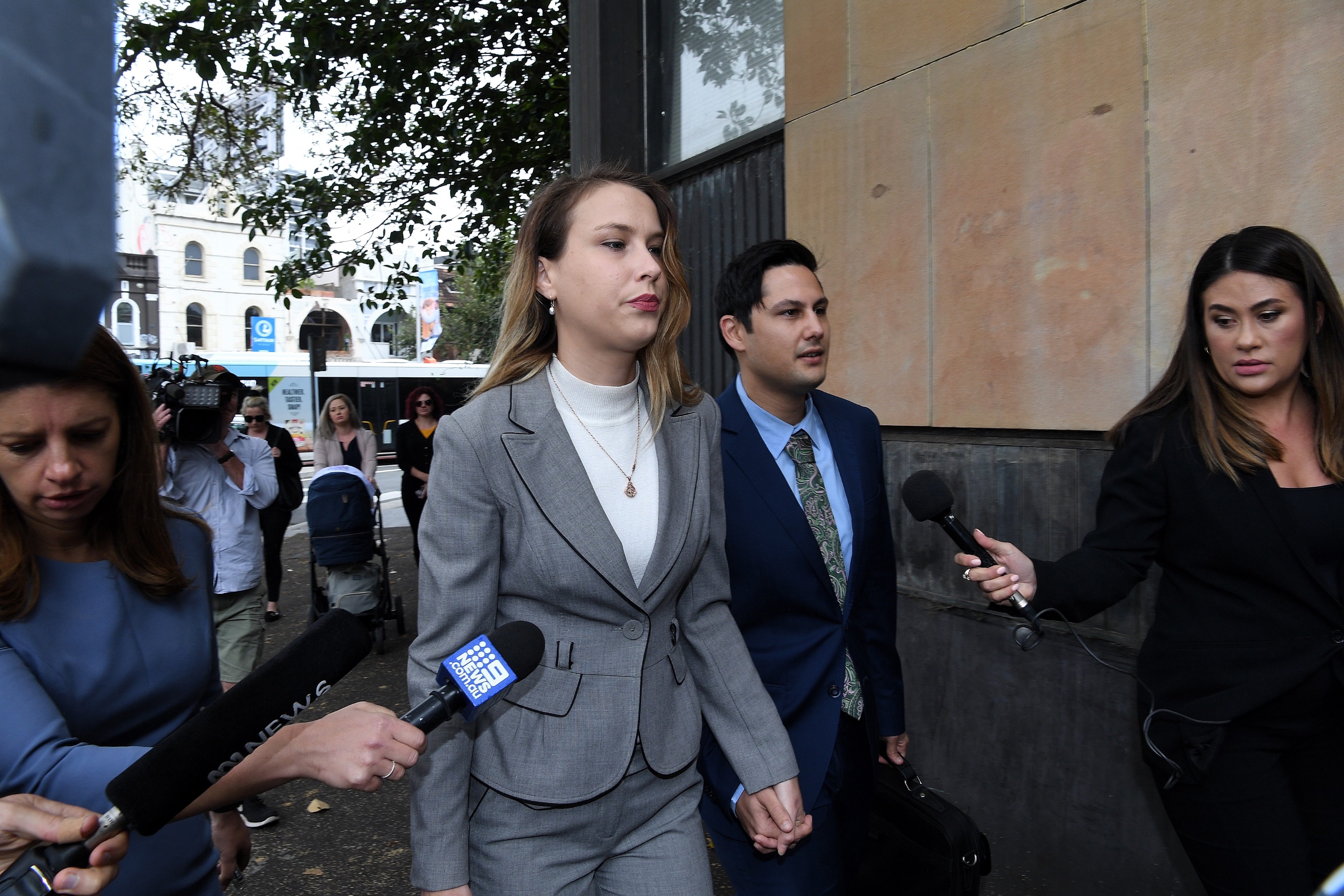 Hannah Quinn (2nd from left) and Blake Davis (2nd from right) arrive at NSW Supreme Court in Darlinghurst, Sydney, NSW. 16th March, 2021. Photo: Kate Geraghty