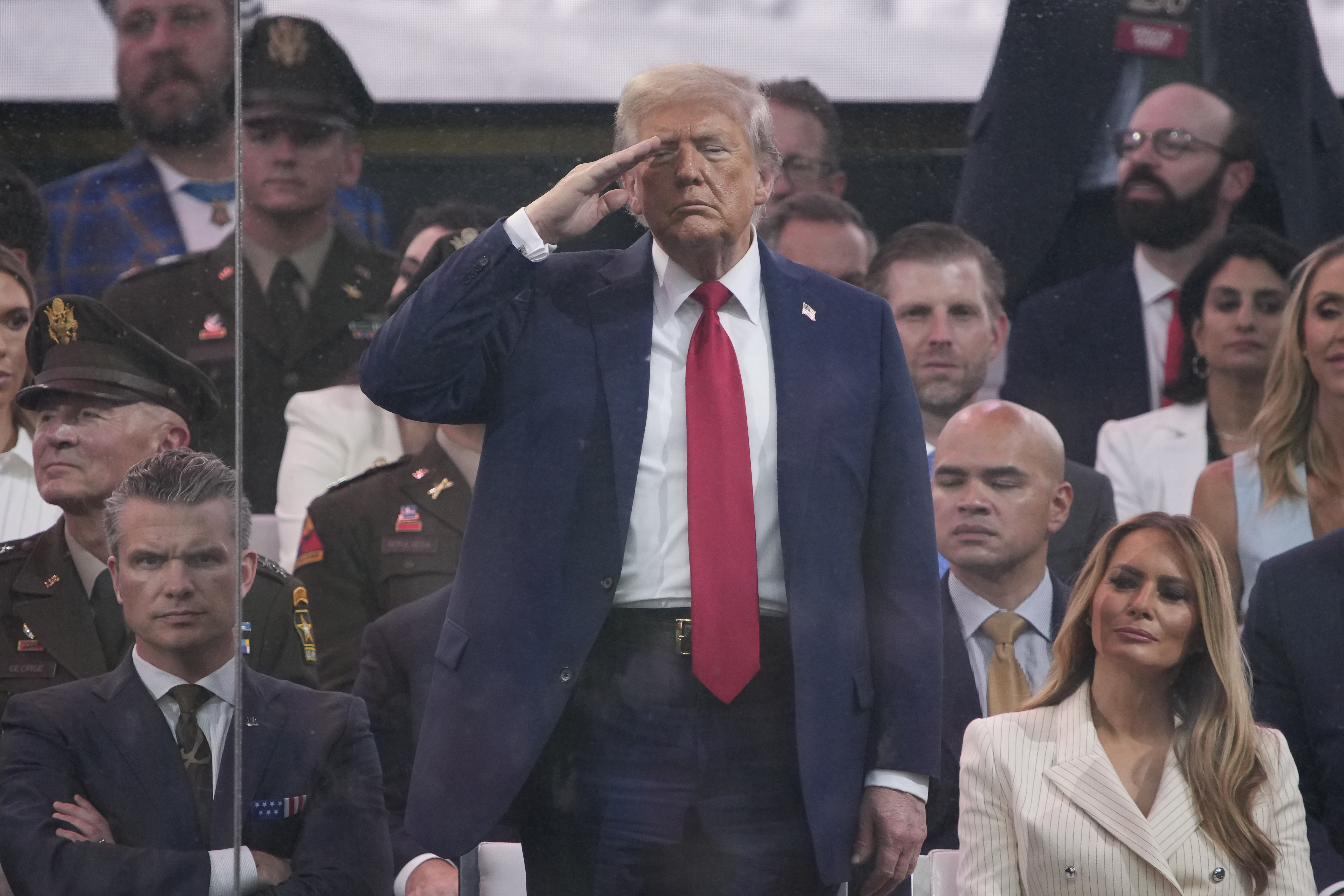 WASHINGTON, DC - JUNE 14: U.S. President Donald Trump salutes as members of the U.S Army participate in the 250th birthday parade of the U.S. Army June 14, 2025 in Washington, DC. The U.S. Army is marking its 250th birthday with a military parade including roughly 6,600 troops, 150 vehicles, and over 50 aircraft.  The parade, which coincides with President Donald Trump's 79th birthday, is designed to tell the history of the Army. (Photo by Andrew Harnik/Getty Images)