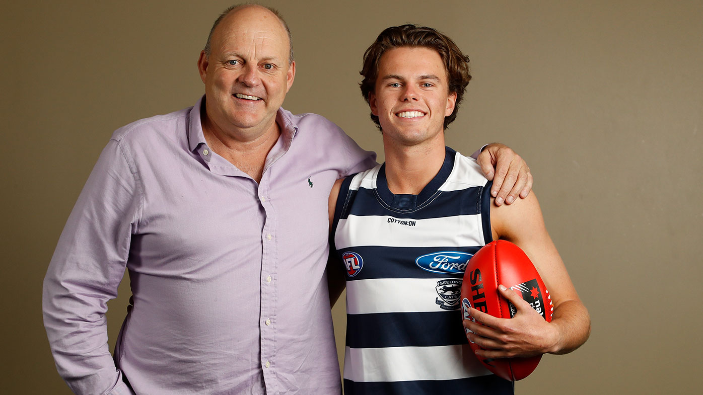 Oscar Brownless of the Cats poses for a photo with his father and Cats champion Billy Brownless during the 2018 NAB AFL Draft