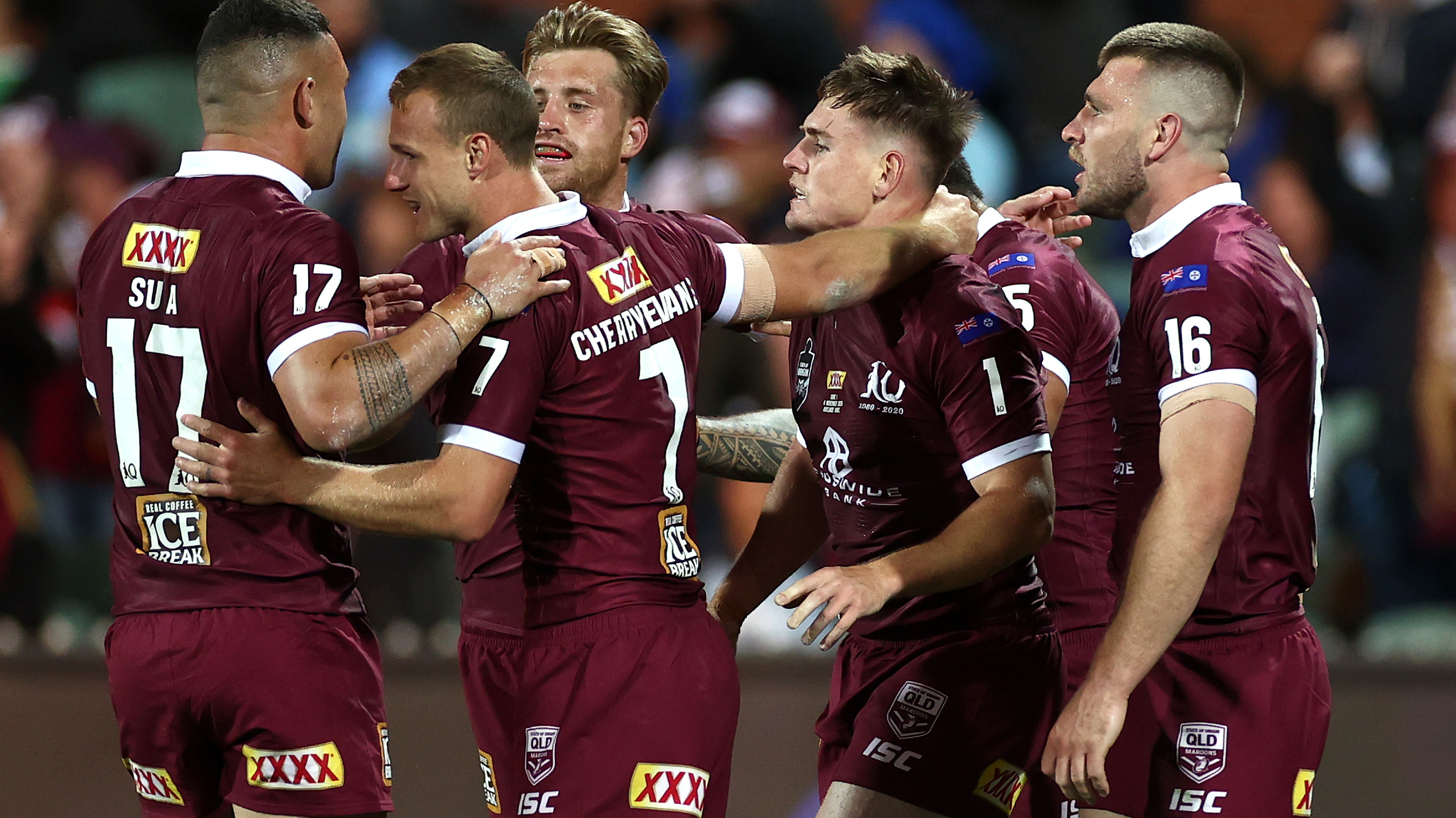 Queensland players celebrate an AJ Brimson try.