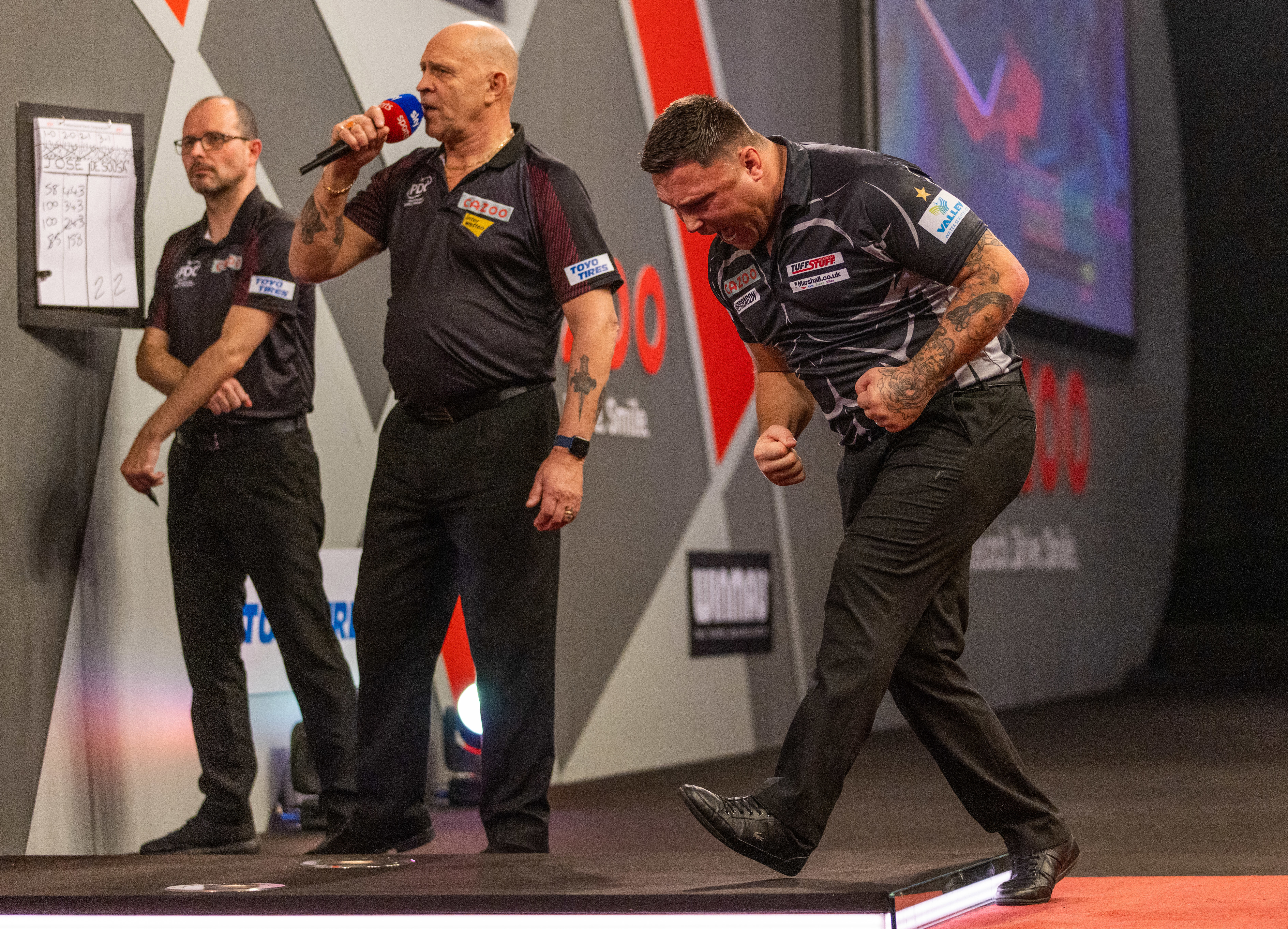 Gerwyn Price celebrates winning against Jose de Sousa.