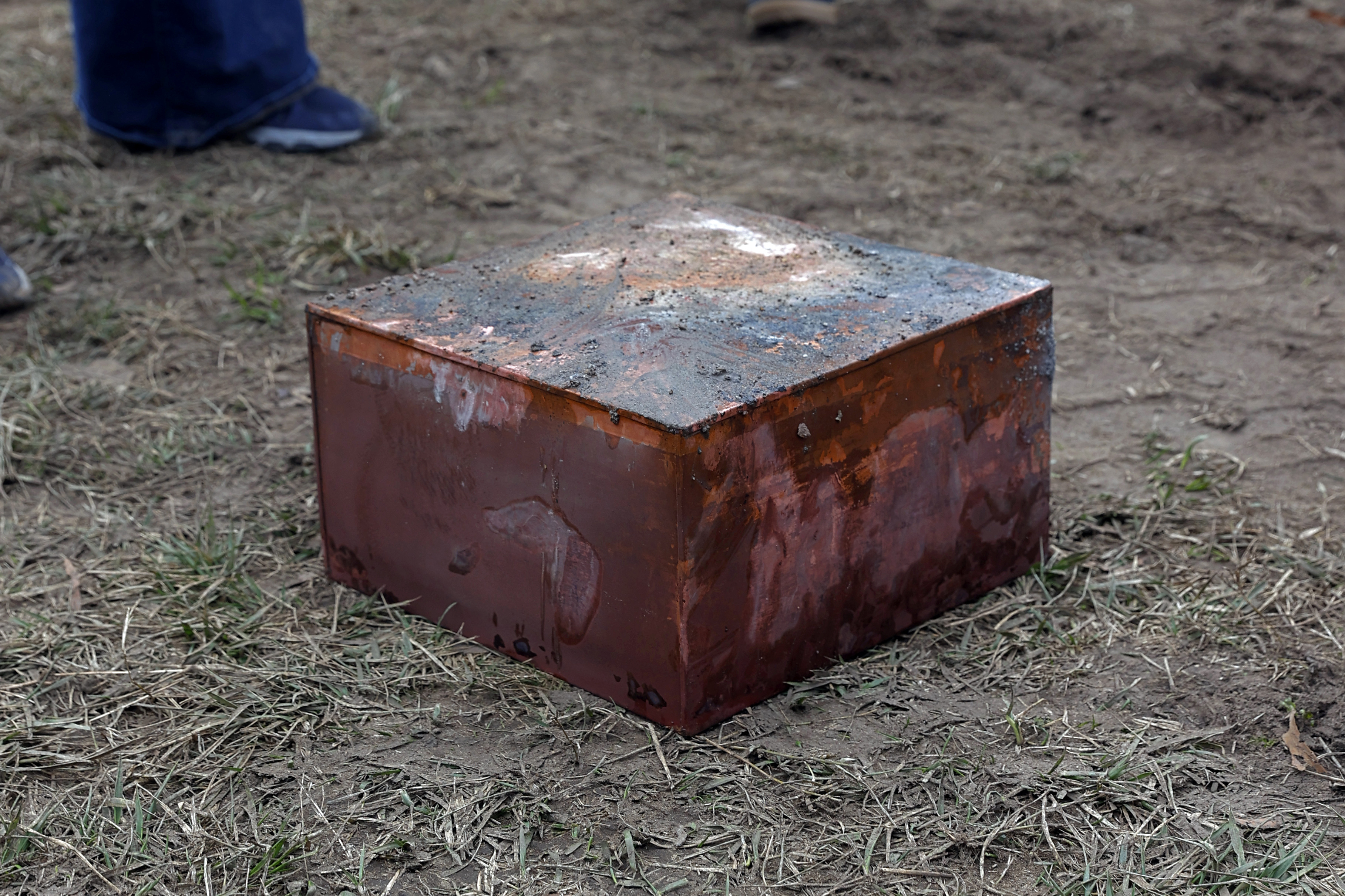 Workers recover a copper box believed to be the 1887 time capsule that was put under the Robert E. Lee pedestal. 