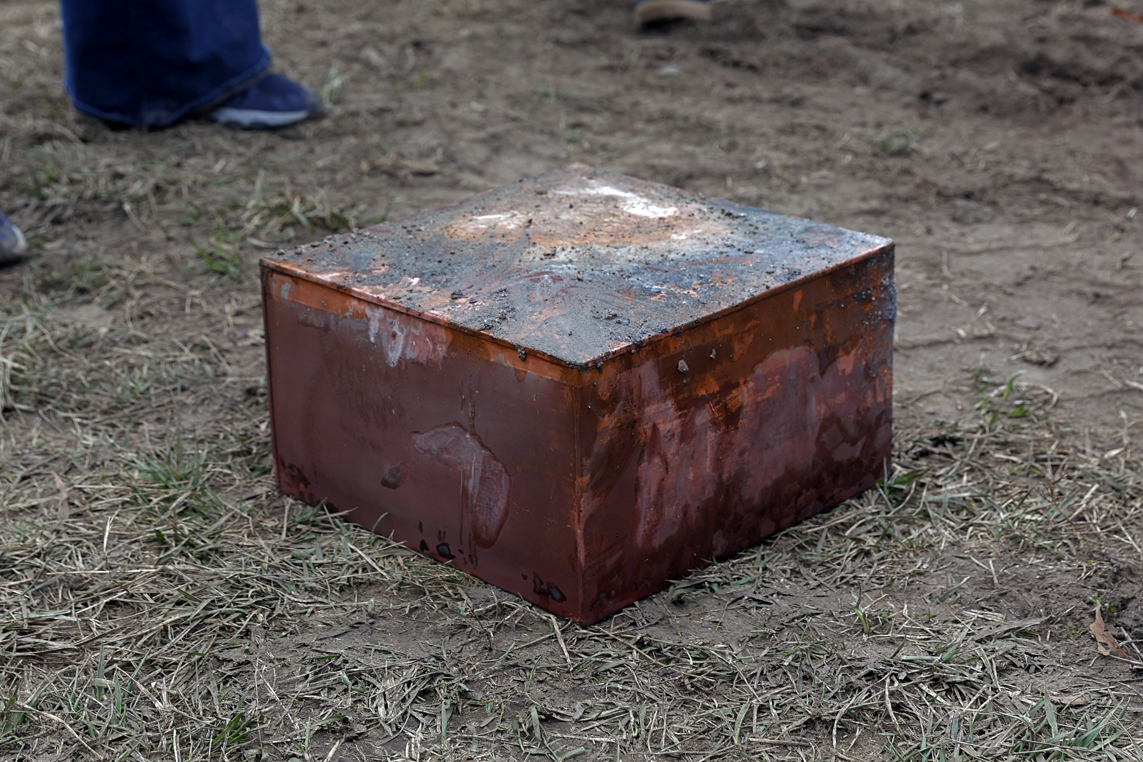 Workers recover a copper box believed to be the 1887 time capsule that was put under the Robert E. Lee pedestal.