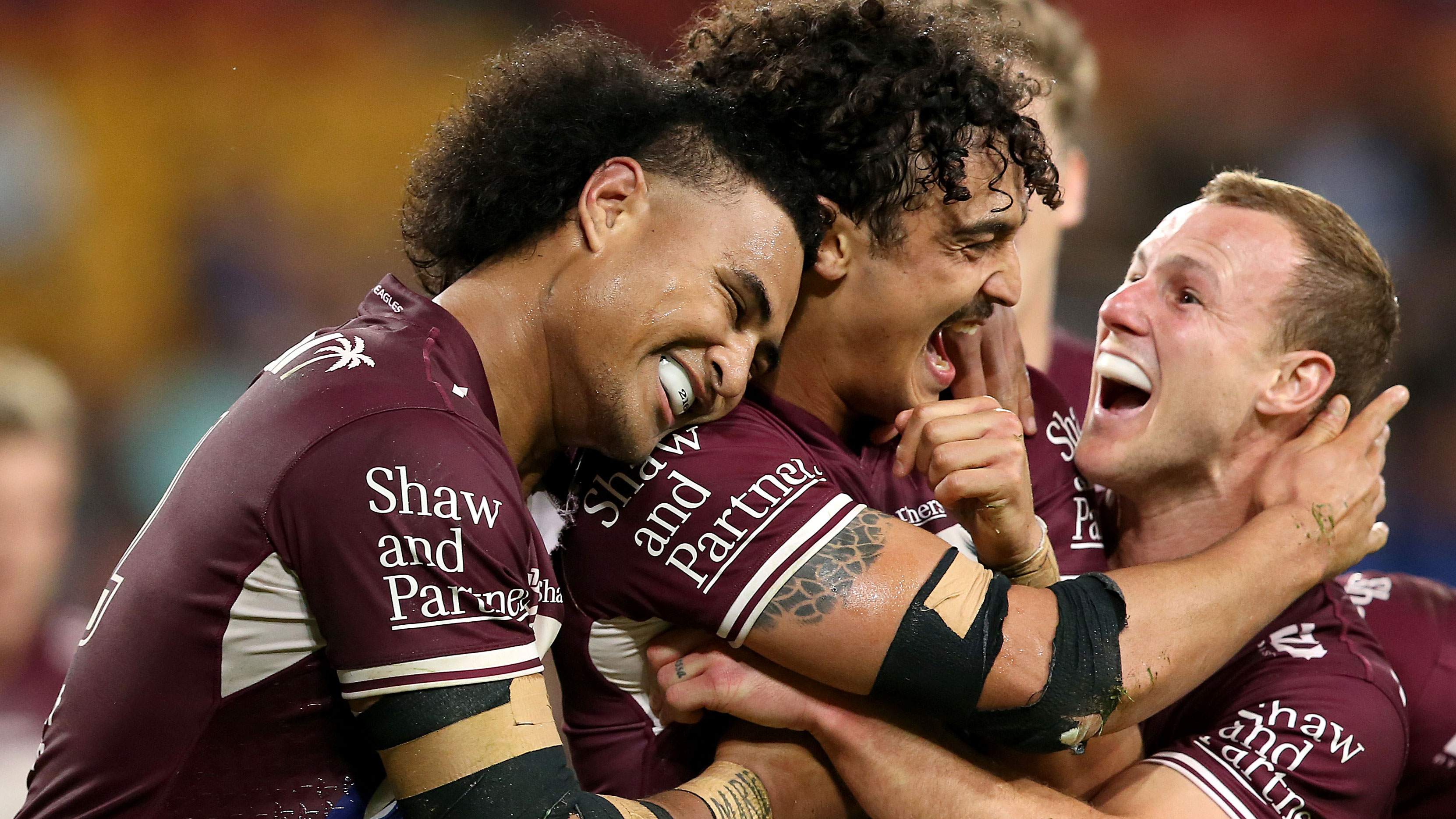 Haumole Olakau'atu, Morgan Harper and Daly Cherry-Evans of the Sea Eagles celebrate a Harper try.