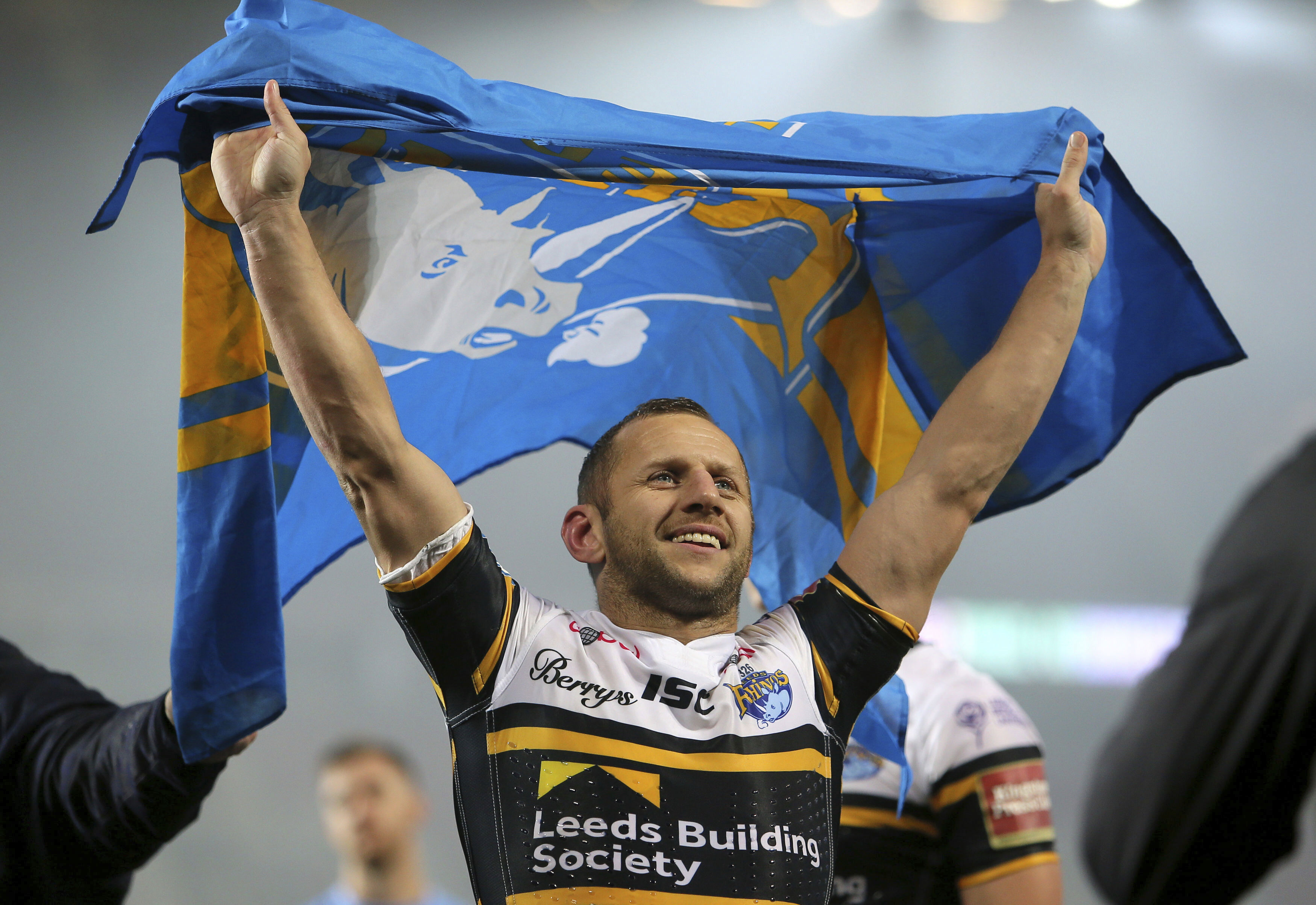 Rob Burrow holds a flag in Manchester, July 10, 2017.