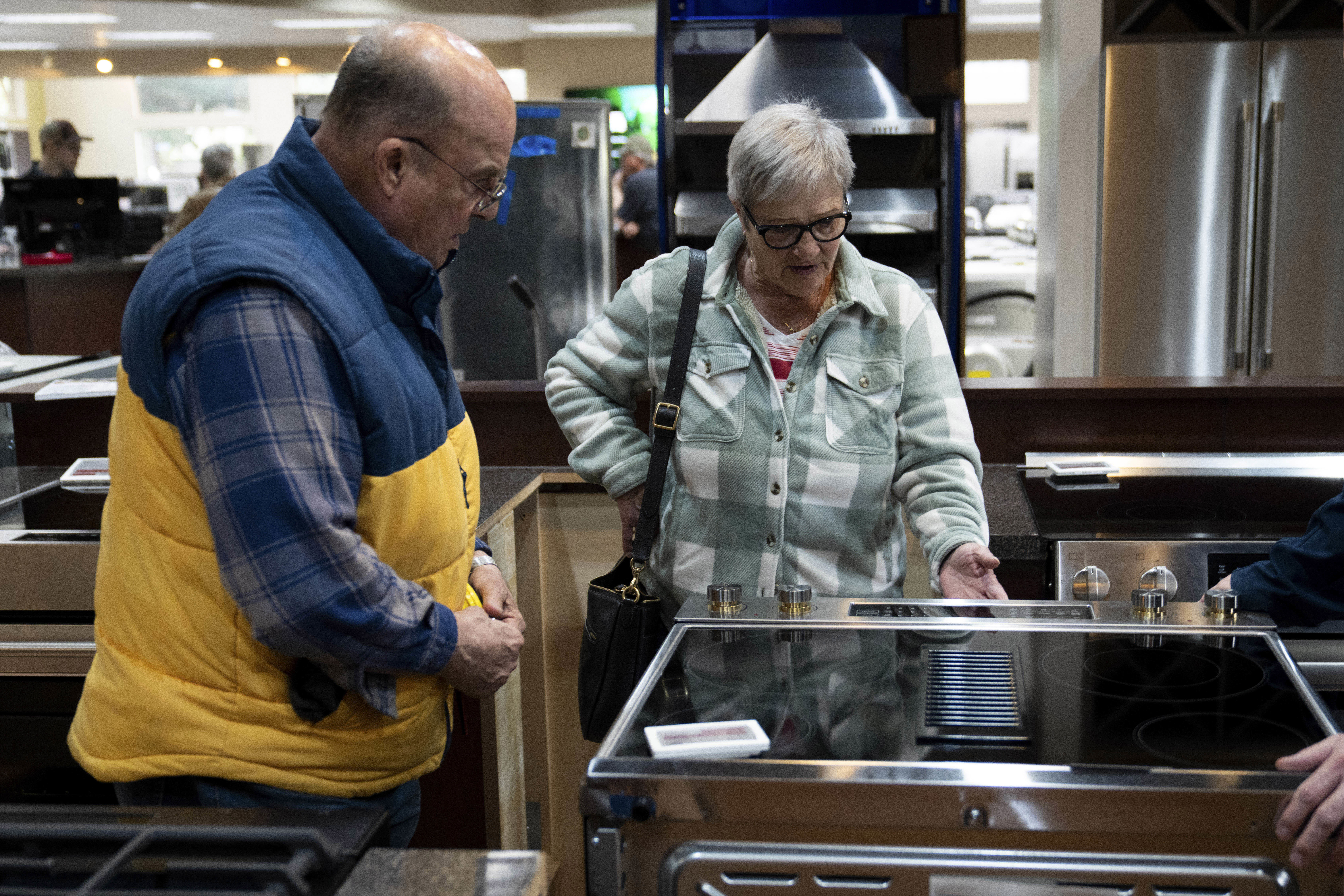 Steve Hankins and his wife Julie look at a stove shops at Riegelmann's Appliance on Thursday, April 3, 2025, in Gresham, Oregon.