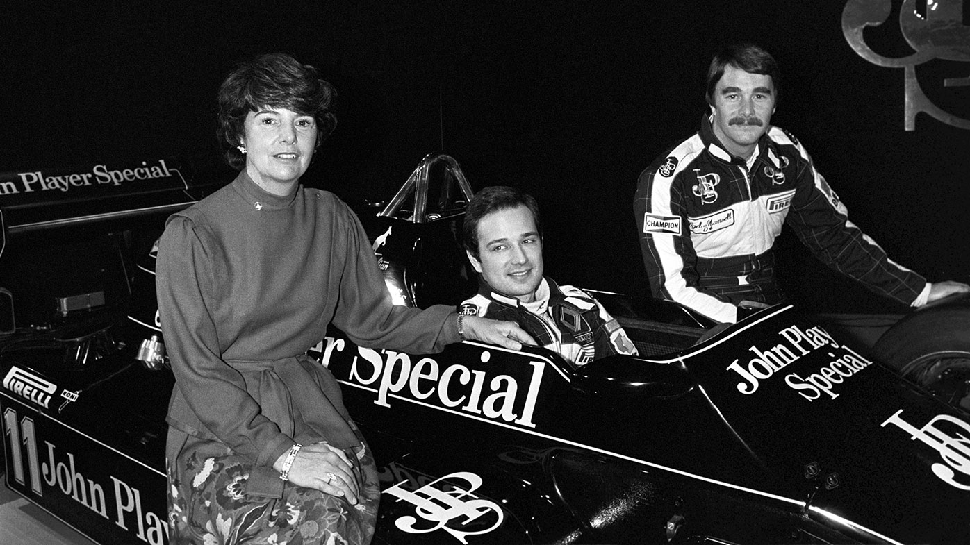 Elio de Angelis (in car) with teammate Nigel Mansell and the widow of Lotus founder Colin Chapman at the launch of the team's 1983 car.