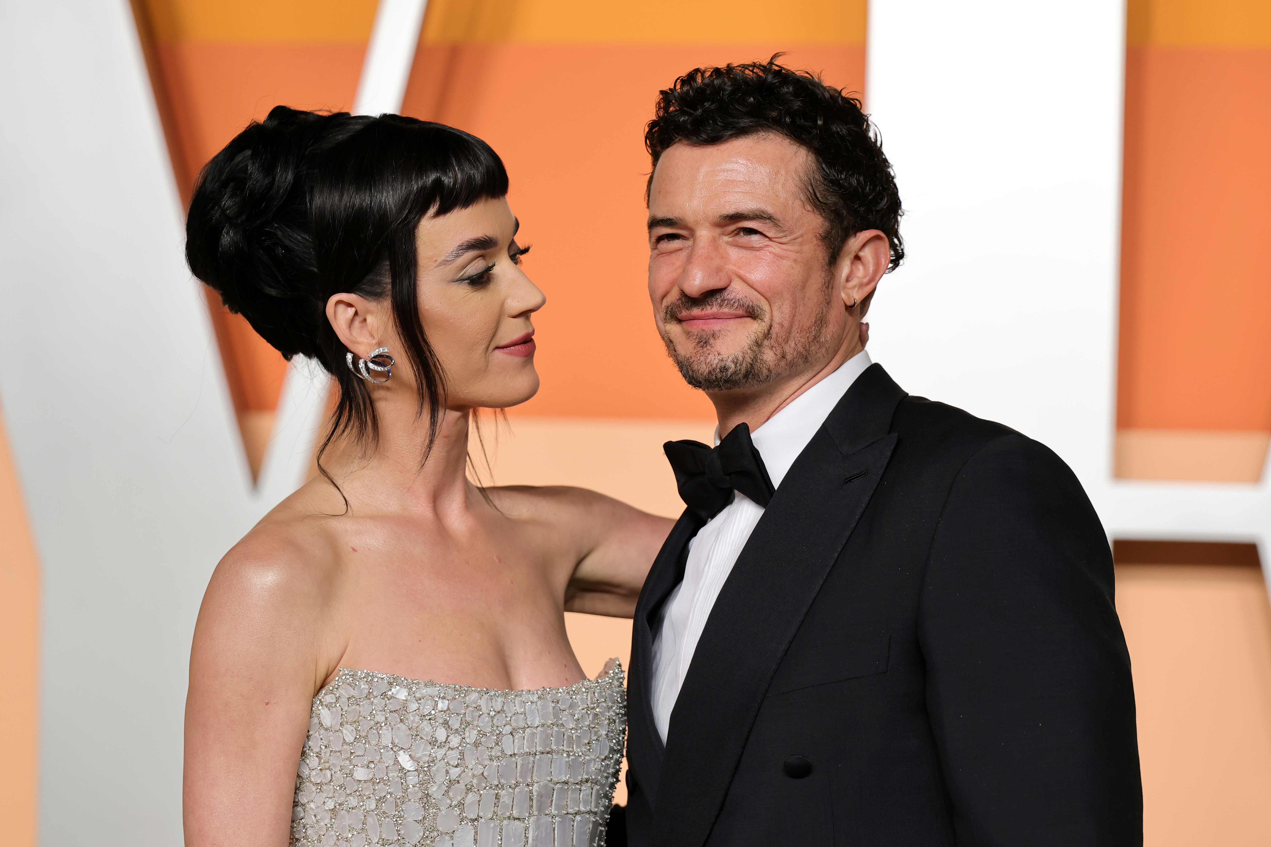 Katy Perry and Orlando Bloom at the 2025 Vanity Fair Oscar Party at Wallis Annenberg Center for the Performing Arts on March 2, 2025 in Beverly Hills, California. 