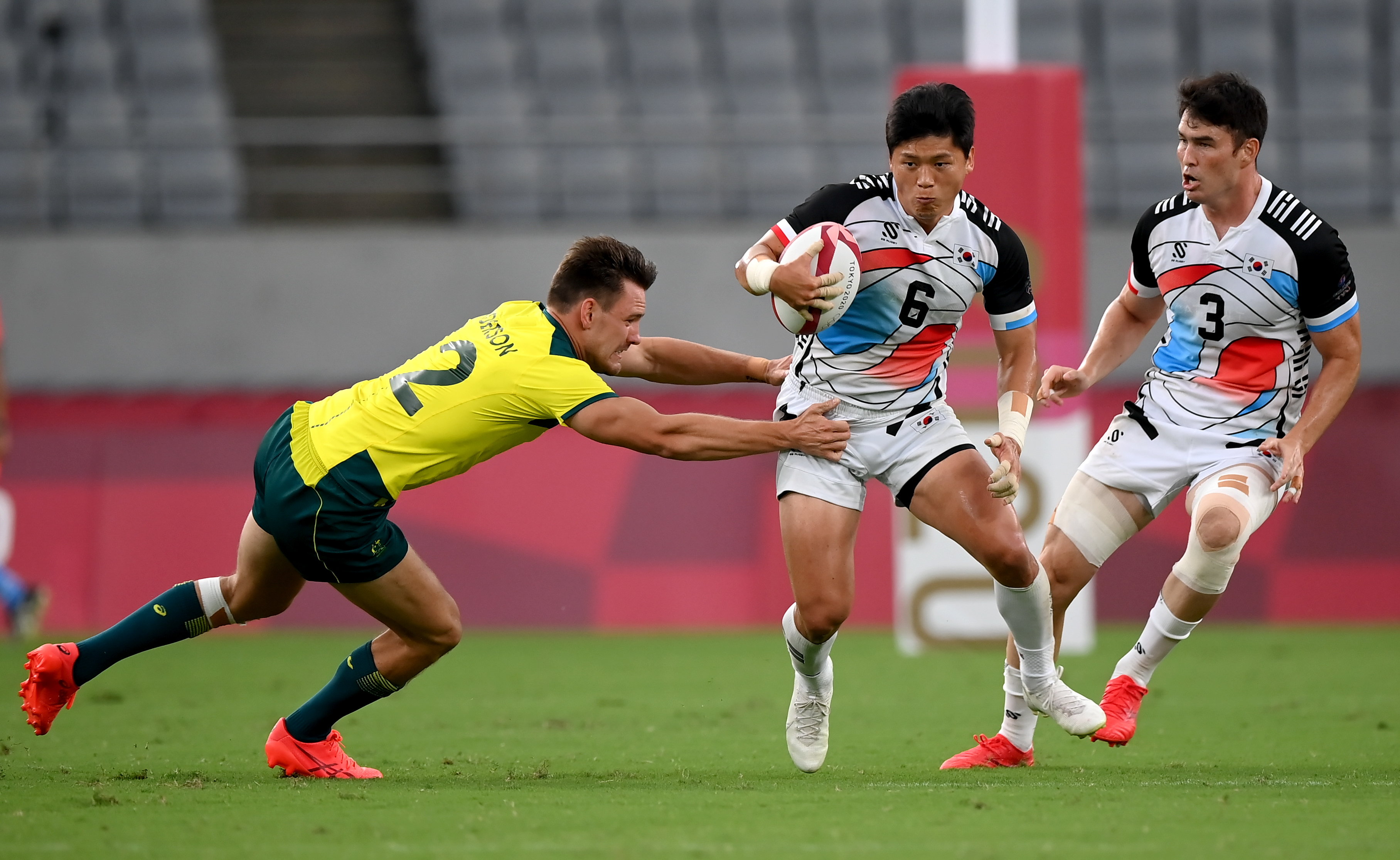 Australia's Lachie Anderson makes a tackle against South Korea.