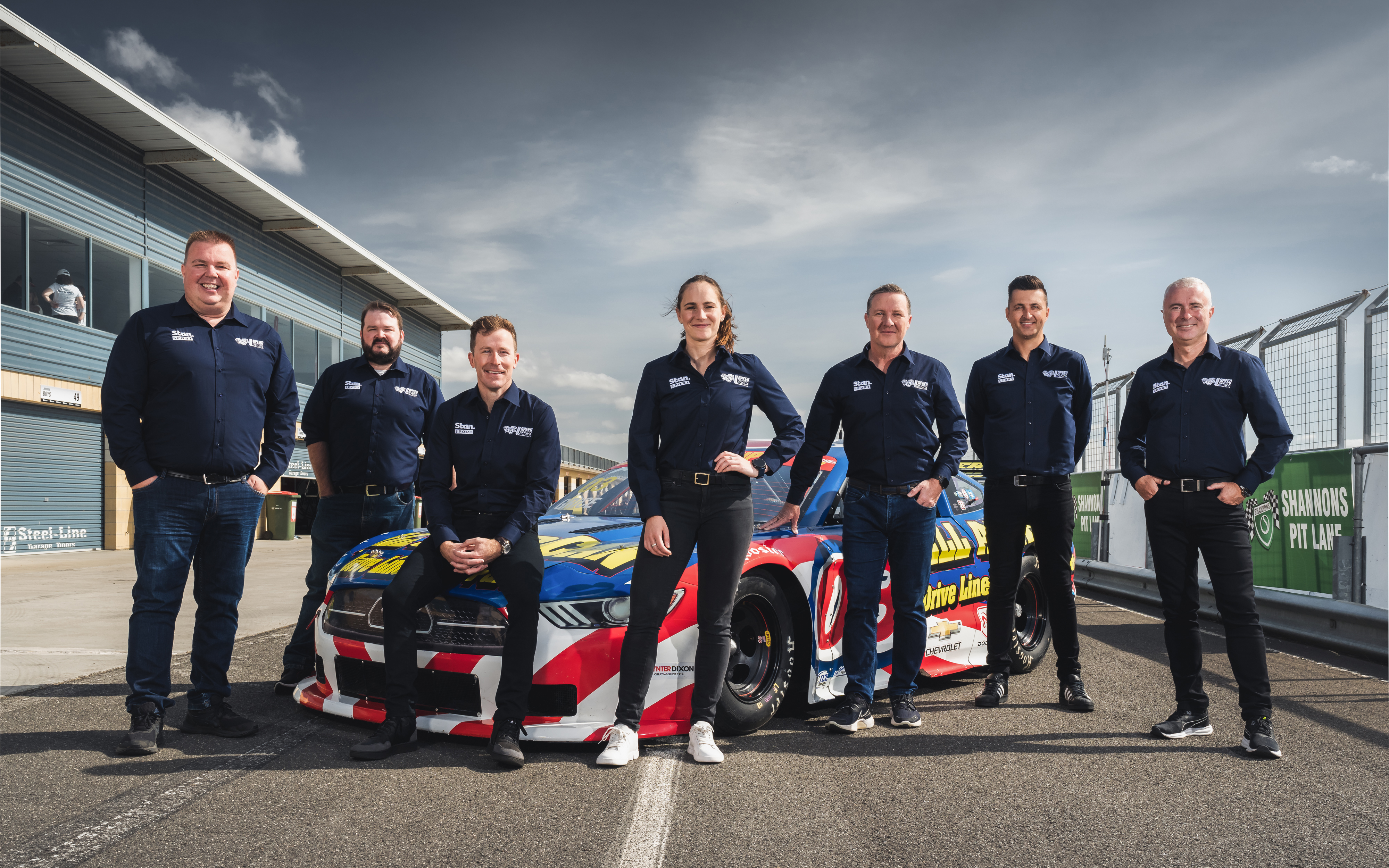 The Stan Sport commentary team of Matt Naulty (from left), Richard Crail, Chris Stubbs, Molly Taylor, Matt White, Fabian Coulthard, and Greg Rust.