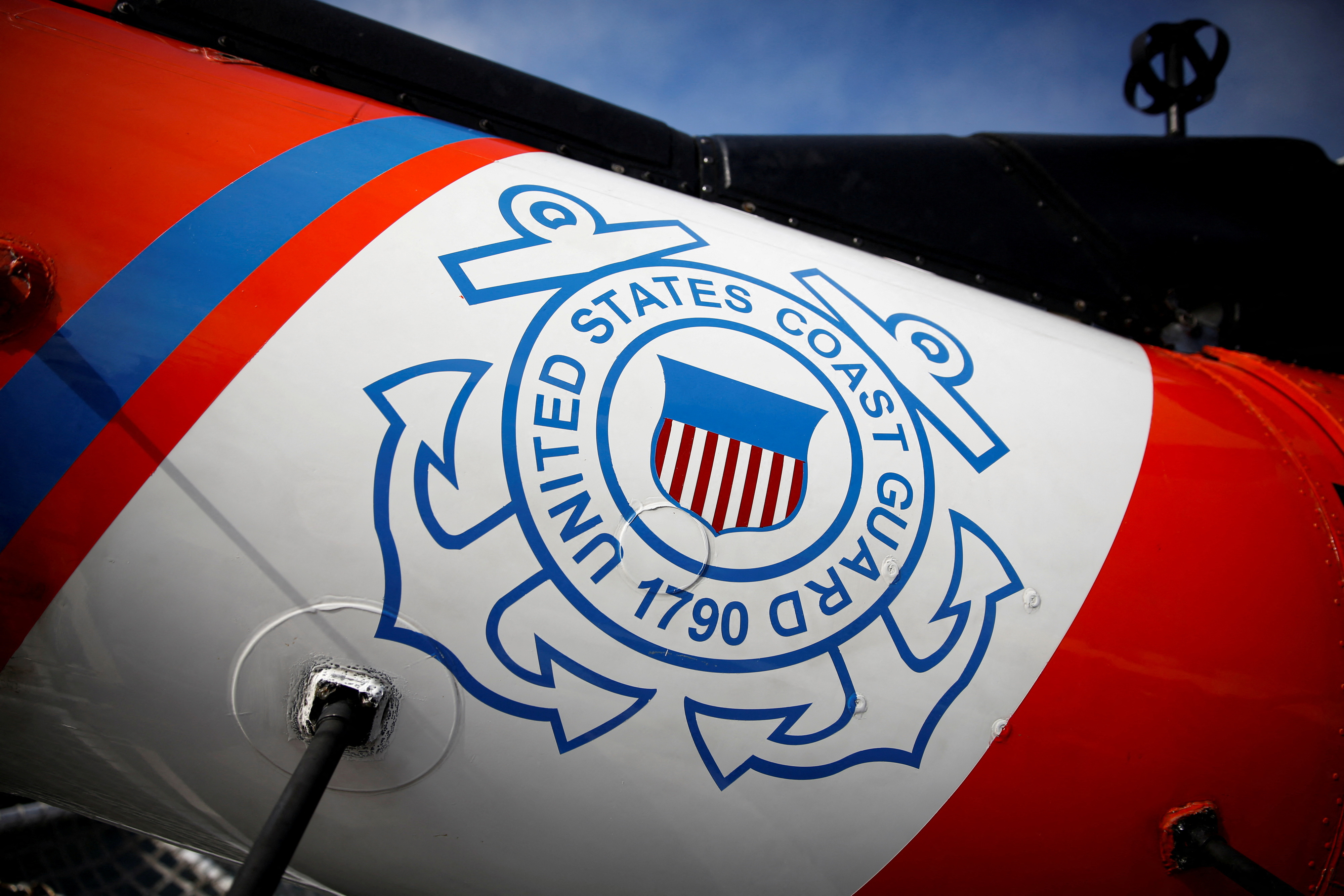 FILE PHOTO: The U.S. Coast Guard's logo is seen on an helicopter on the deck of the Coast Guard Cutter Hamilton at Port Everglades, in Fort Lauderdale, Florida, U.S. November 22, 2021. REUTERS/Marco Bello/File Photo