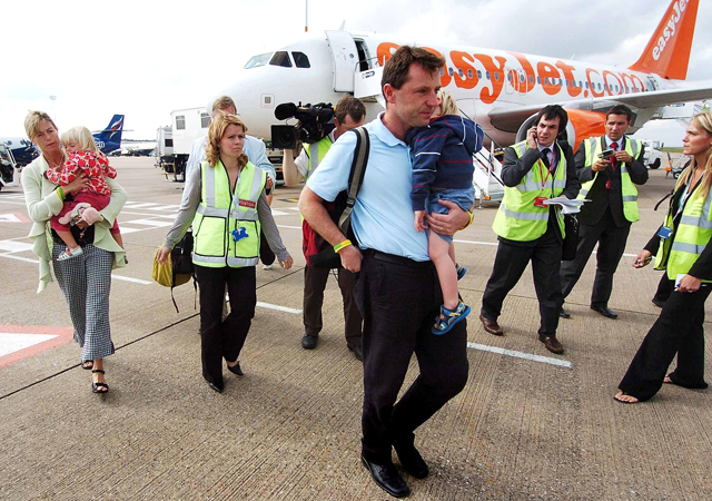 Kate and Gerry McCann, with twins Sean and Amelie, arrive at East Midlands airport in England in September 2007, after leaving Portugal.