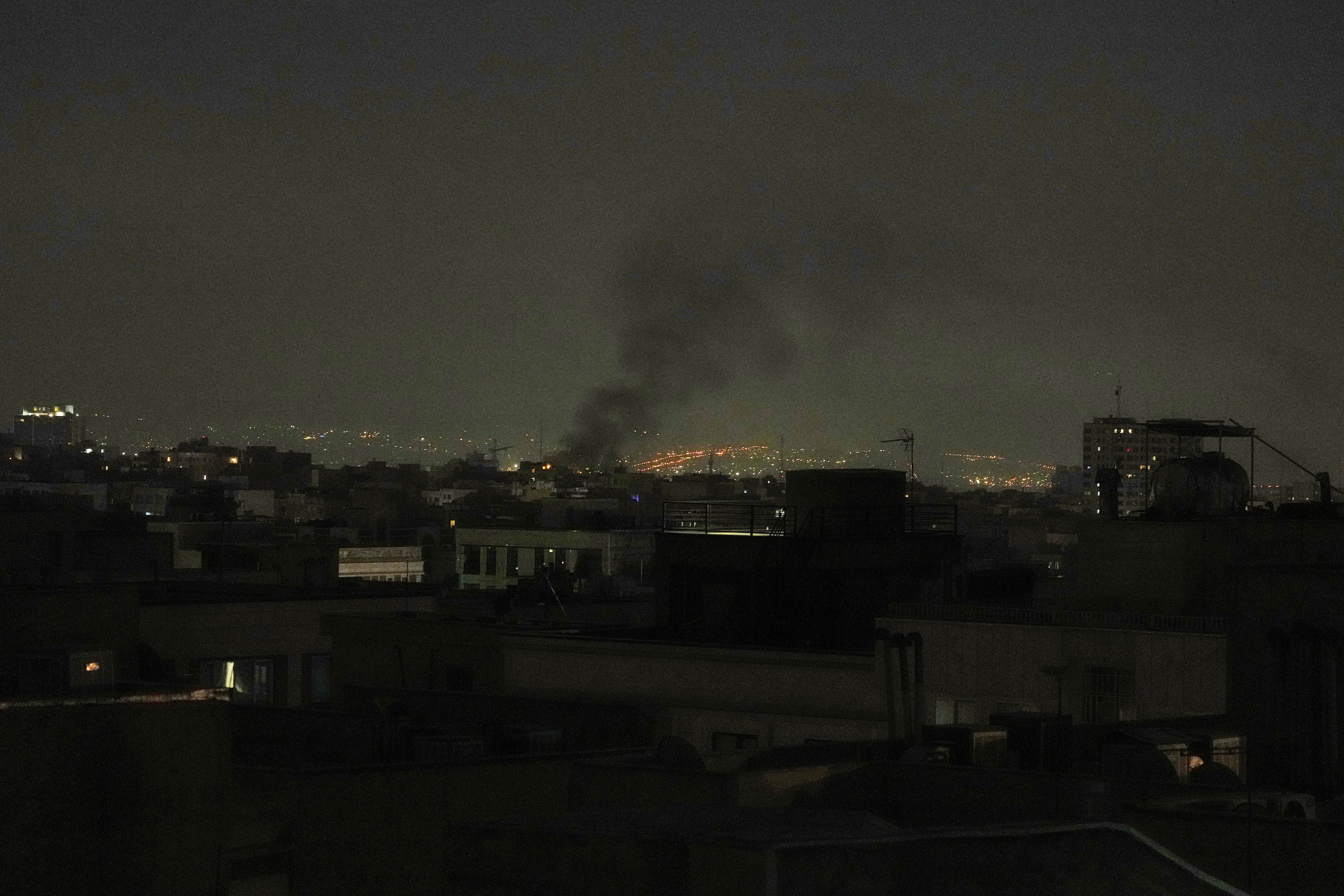 Smoke can be seen in the Tehran skyline after Israel's strikes on Iran.