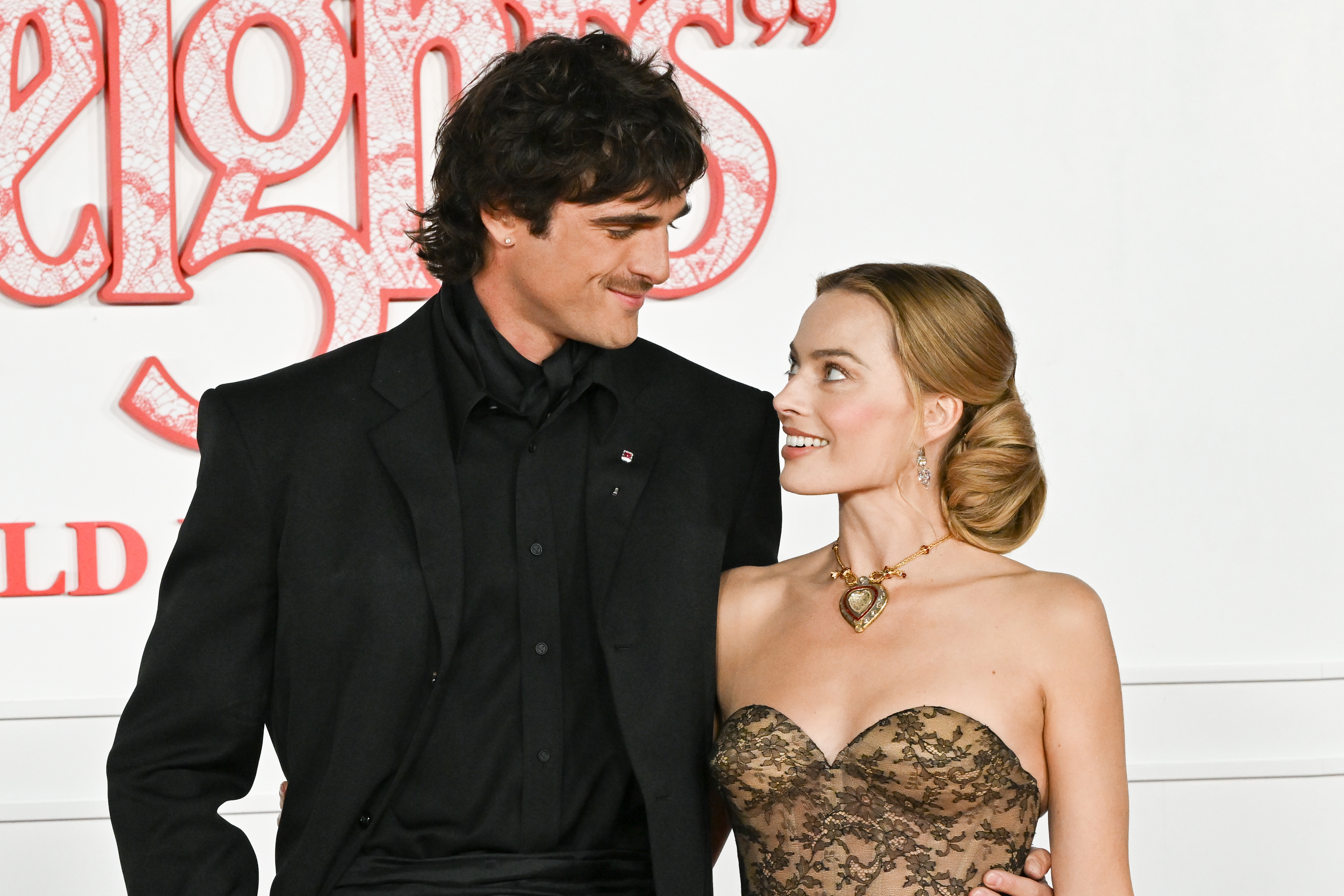 Jacob Elordi and Margot Robbie attend the world premiere of Wuthering Heights at TCL Chinese Theatre on January 28, 2026 in Hollywood, California. 