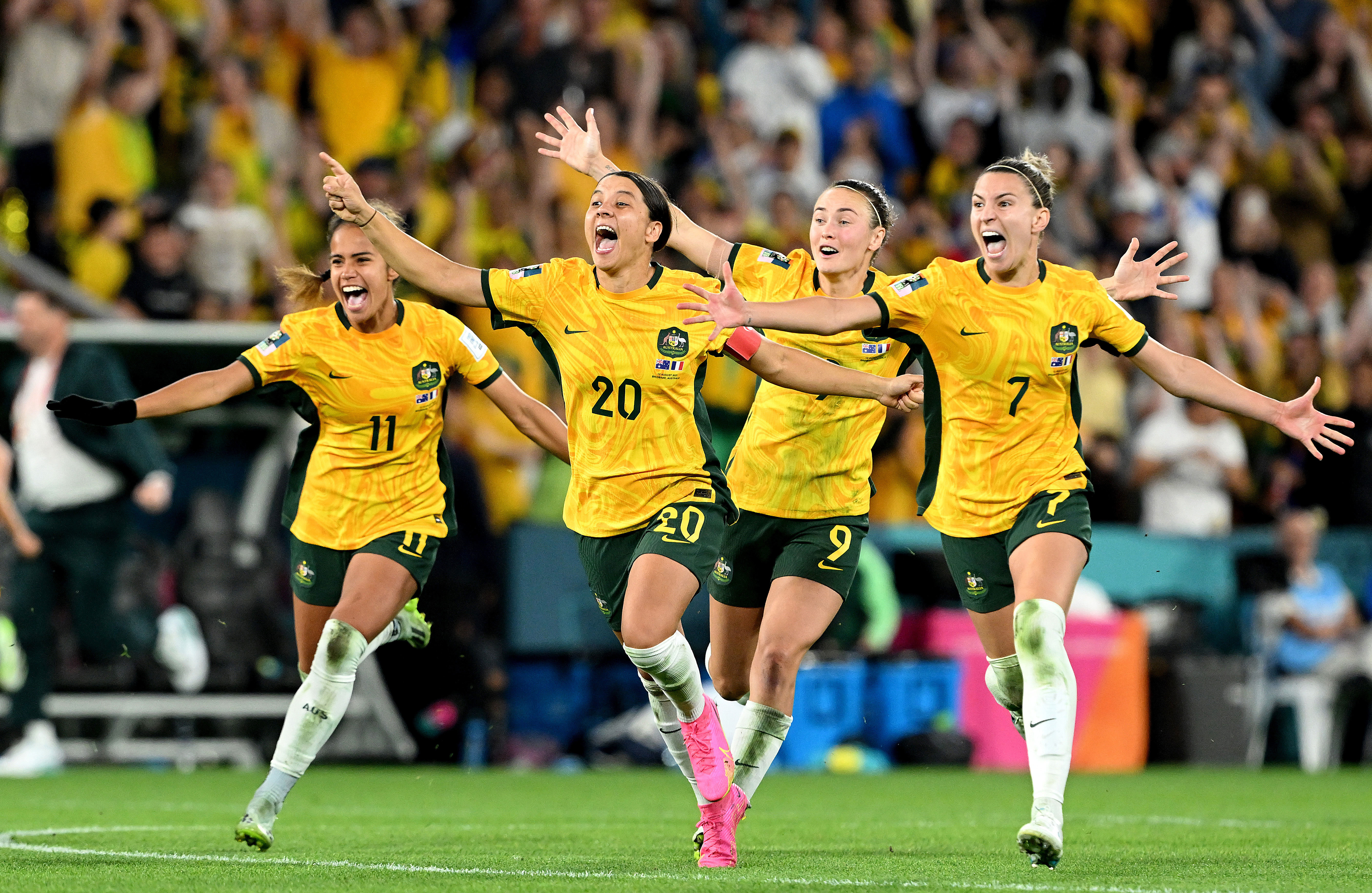 Australia celebrate their victory in the penalty shoot out against France.