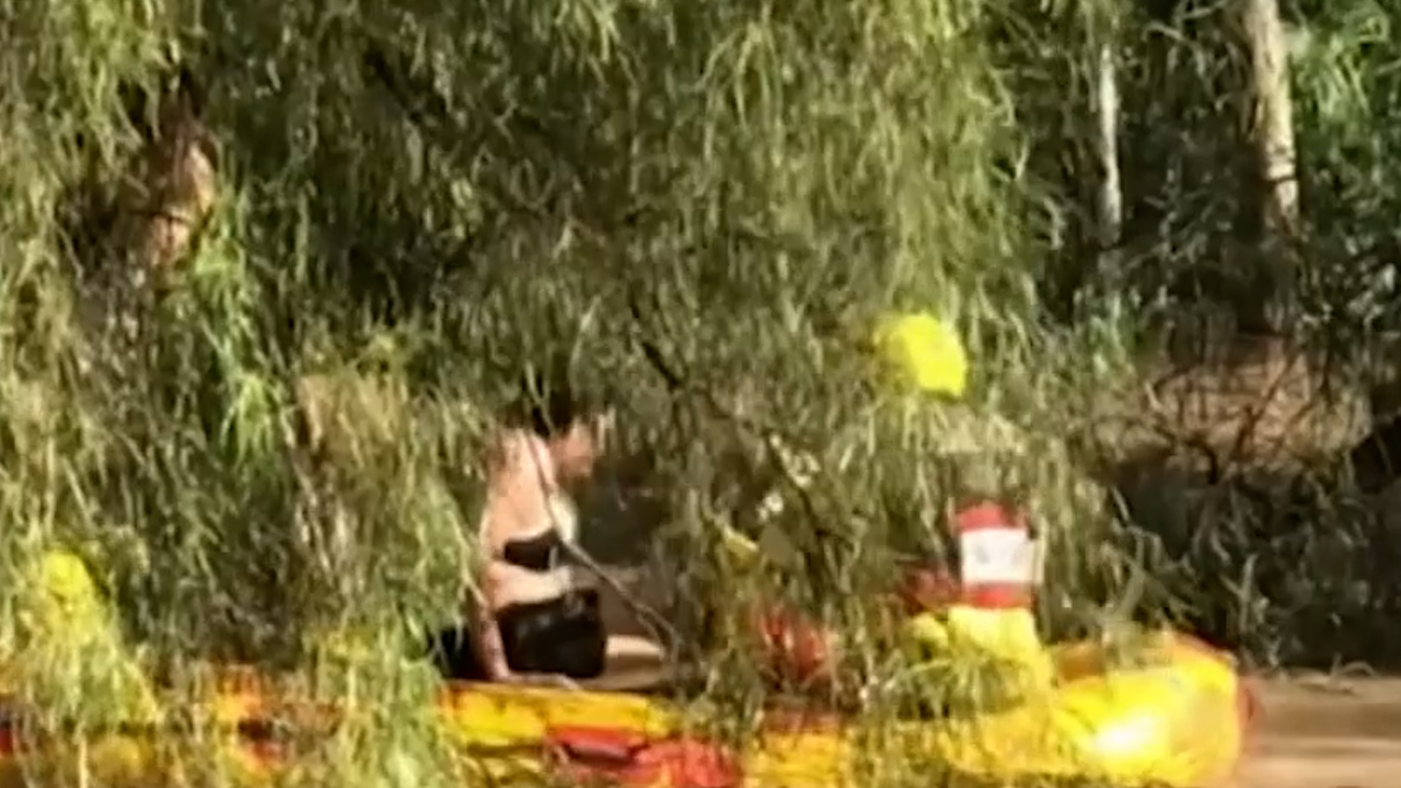 The girl clung on for life while waiting for the Swift Water Rescue team to arrive. 