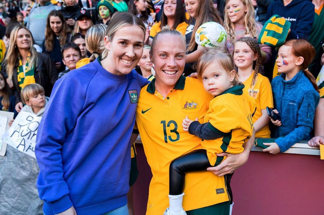 Tameka Yallop of the Matildas with wife Kirsty Yallop and daughter Harley.