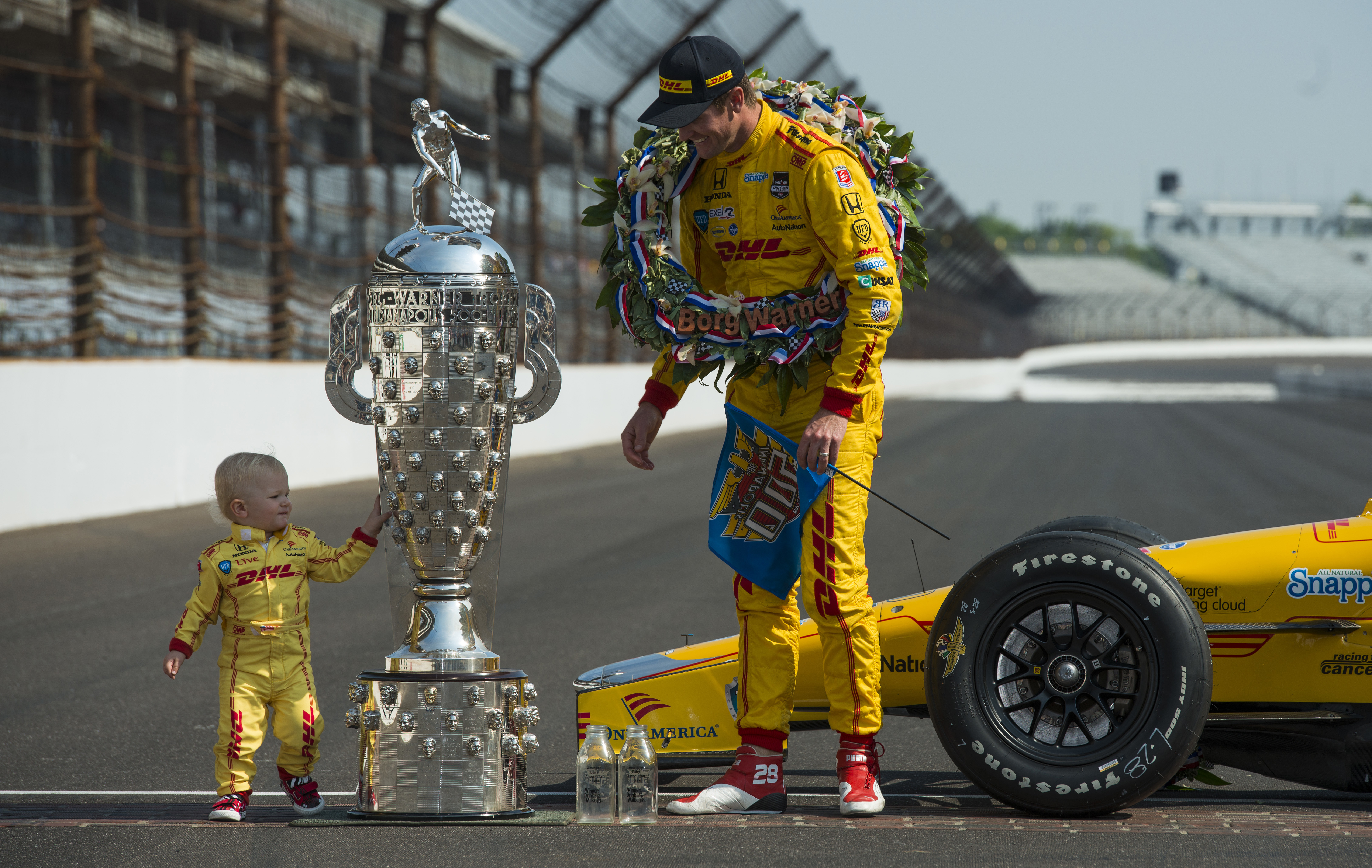 Ryan Hunter-Reay and his son Ryden pose with the Borg-Warner Trophy.