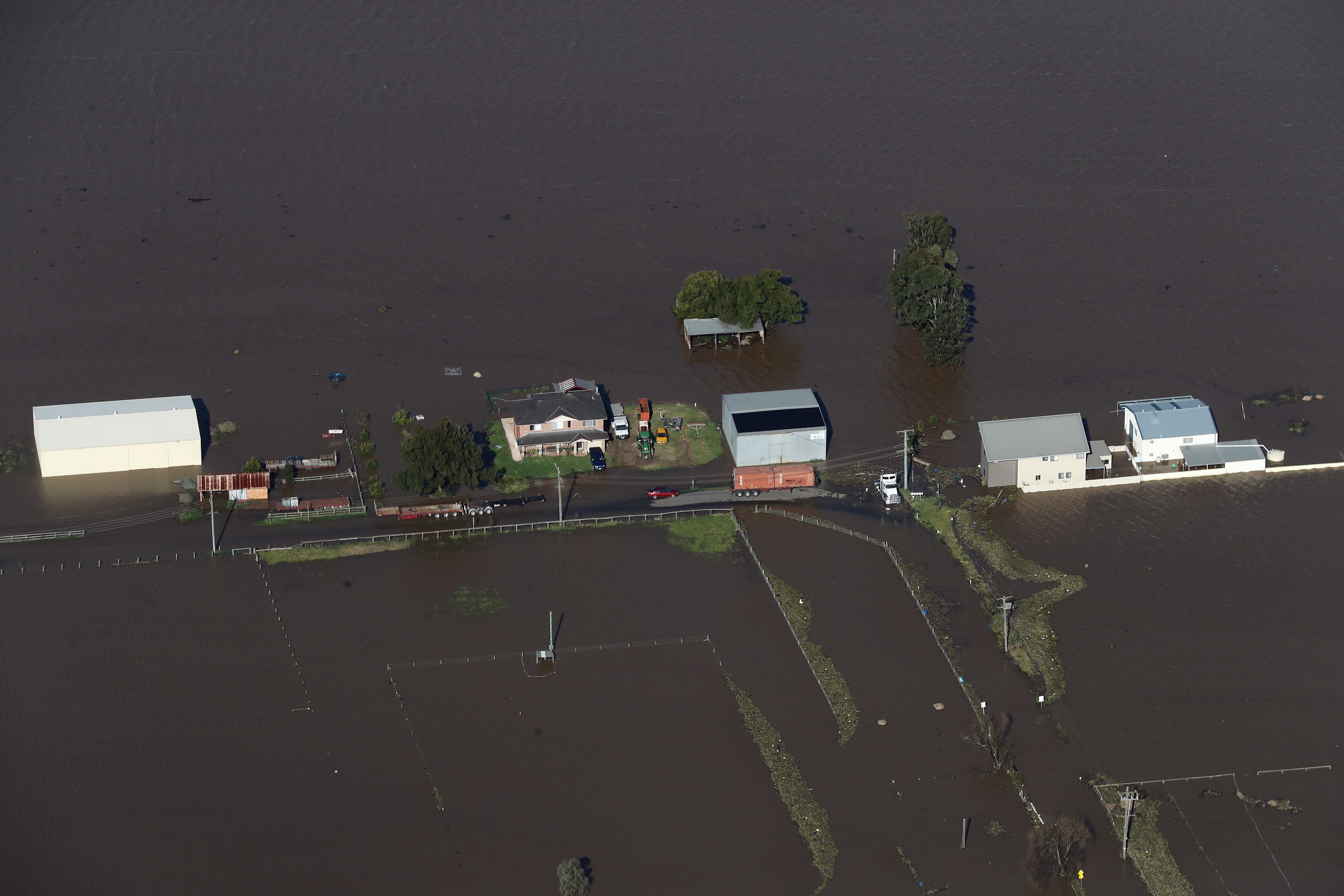 NSW Premier Dominic Perrottet surveys the floods in the Hunter Region in a chopper this morning with Minister for Emergency Services and Resilience and Minister for Flood Recovery Steph Cooke. Pictured is flooding in and around Maitland. Picture: David Swift