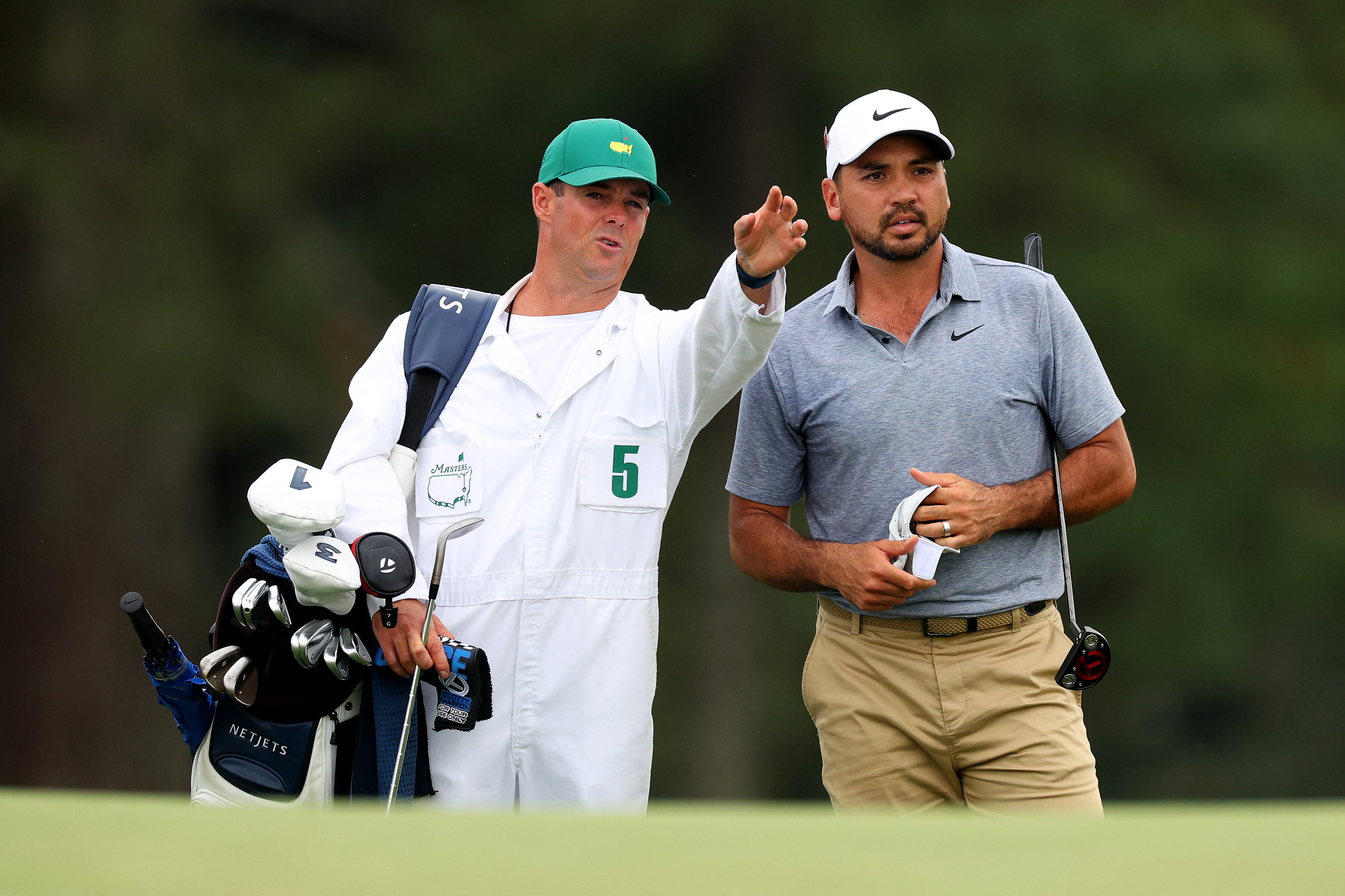 Jason Day of Australia talks with his caddie Luke Reardon on the 18th hole during the first round of the 2023 Masters Tournament at Augusta National Golf Club on April 06, 2023 in Augusta, Georgia. (Photo by Andrew Redington/Getty Images)