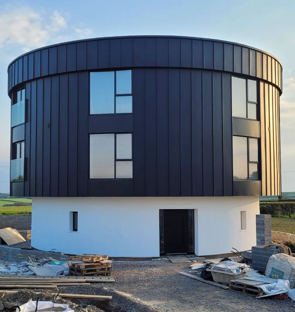 Man transforms an abandoned concrete water tower into a contemporary family home.