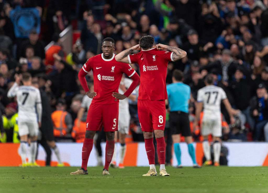 Dominik Szoboszlai and Ibrahima Konate of Liverpool look dejected after Atalanta's third goal.