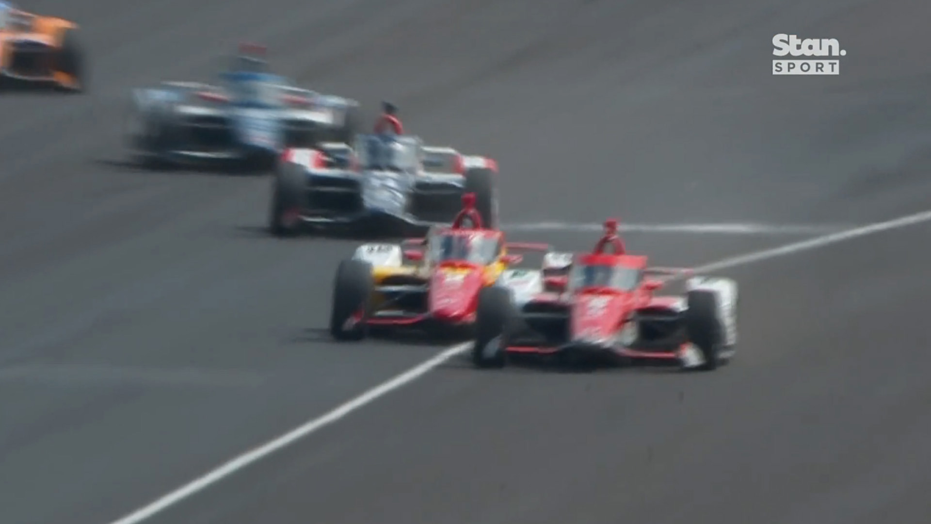 Marcus Ericsson tried to break Josef Newgarden's slip stream by diving below the white line on the back straight out of turn two.