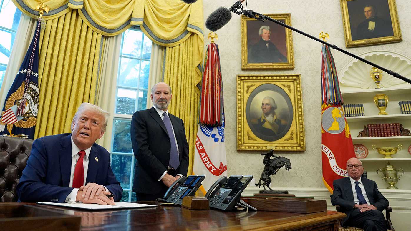 Rupert Murdoch sits in the Oval Office while Donald Trump talks.