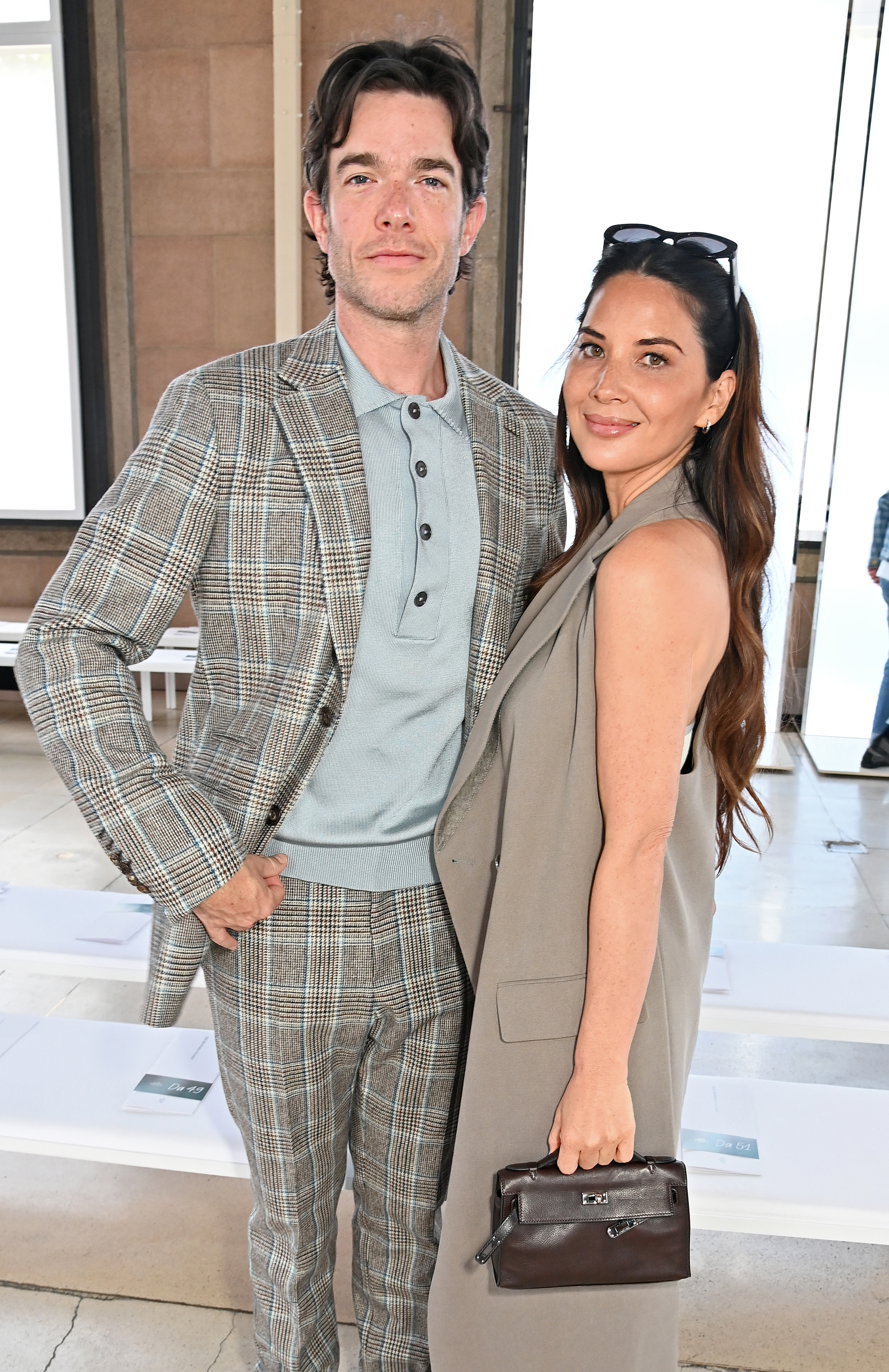 PARIS, FRANCE - JUNE 21: John Mulaney and Olivia Munn attend the Hermes SS25 Men's Show as part of Paris Fashion Week at Palais d'Iena on June 22, 2024 in Paris, France. (Photo by Dave Benett/Getty Images for Hermes)